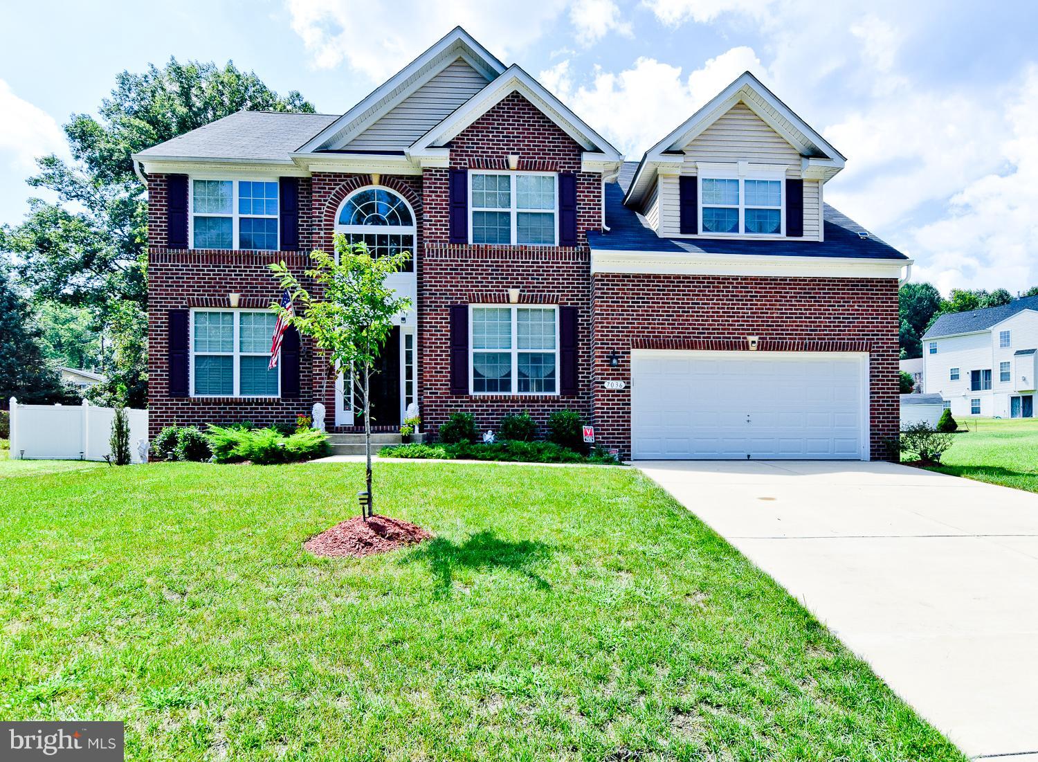 Stately Brick front located in desired Timber Ridge. Enter to Gleaming hardwood floors. Enjoy the beautiful sun drenched two story family room. Prepare meals in the Gourmet kitchen with granite, 42 inch cabinets & double oven. Relax in the Master suite fit for royalty with a sitting area, spacious walk in & incredible bath. Finished walk out basement with bath, mud room & large privacy fenced rear