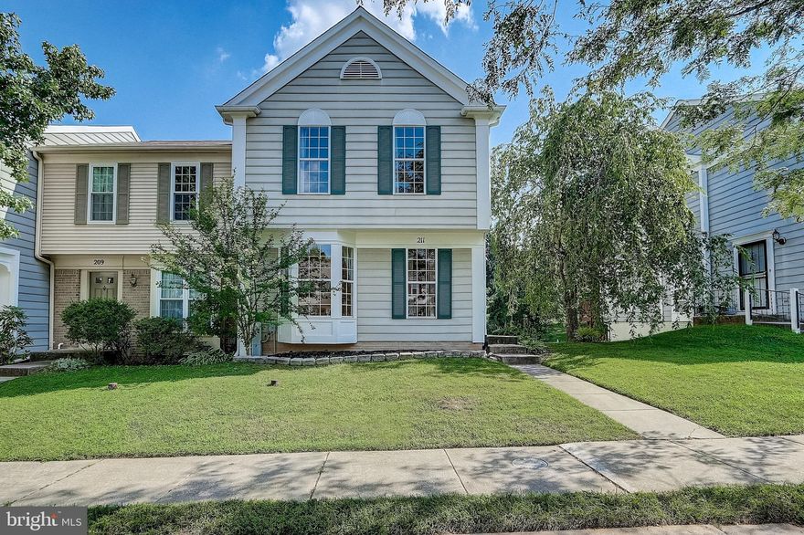 Welcome to this lovely end-unit townhome located in the sought-after Pleasant Hills community! Fresh paint and crisp trim throughout the home create a bright, modern feel from the moment you step through the brand new main entrance storm door. The spacious living area is perfect for relaxing or entertaining. The kitchen features an island with a cozy breakfast bar - ideal for casual dining or gathering with friends and family. The dining area has access to the generously sized, recently refurbished rear deck that backs to trees, providing a peaceful and private outdoor retreat. Step outside and enjoy your morning coffee. A half bath completes the main level. Upstairs, the primary bedroom features soaring vaulted ceilings, a generous walk-in closet, and a private ensuite bath for added comfort. Two additional bedrooms and a full bath complete the upper level. The sizable lower level recreation room boasts a full bath, laundry/storage area, and walk-out access to the rear yard. Thompson Creek windows and sliding glass doors were installed in 2021. Two assigned parking spaces are included, with additional unassigned guest parking in the community, ensuring convenience for both residents and guests. Located near an abundance of dining, shopping, and recreation including Northwest Regional Park and Irvine Nature Center. Welcome Home!