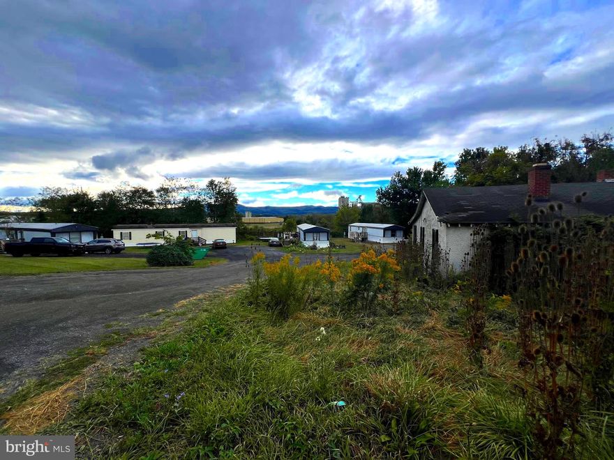 Toll Gate Court currently has four mobile homes, with room and hook ups for two additional mobiles.
The existing house on the property needs to be torn down. This is a great investment property at the south end of Moorefield on the west side of Rt. 220.  All units are rented to long term tenants,  so it is a turn-key investment.