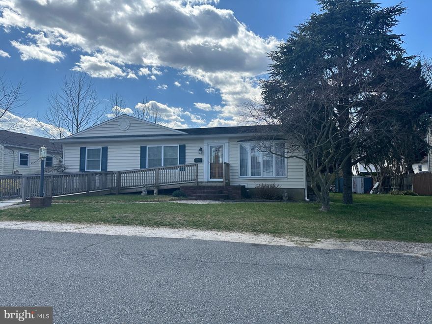 Major price improvement!!! Welcome to your new home. This well maintained rancher, nestled on an expansive double-sized lot just steps away from the community beach, exudes charm and sophistication. Boasting original ownership, this home has been lovingly cared for and thoughtfully upgraded throughout the years.  Ready to make it your own. Step inside to discover the warmth of the living room, anchored by a stunning stone wall fireplace, creating a cozy ambiance perfect for gathering with loved ones. The spacious family room is bathed in natural light, featuring cathedral ceilings adorned with two ceiling fans, built ins and Pella sliders leading to a composite deck with vinyl railings, seamlessly blending indoor and outdoor living. The kitchen is showcasing wood cabinets, Corian countertops, pantry and a delightful breakfast room surrounded by large Andersen windows. Adjacent, a covered patio and screened porch invite you to enjoy the outdoors. The primary bedroom,  offers versatility and comfort, boasting hardwood flooring under the carpet and ample space for rest and relaxation. upgrades include architectural-grade shingles, replacement windows, and bead rolled vinyl siding for a modern, maintenance-free aesthetic. newer Trane HVAC, a partially finished basement awaits your personal touches, featuring a full bath and offering endless possibilities - whether you envision future additional bedrooms, a family room, a recreation space, or a convenient in-law suite with a walkup to the rear yard. Home also has a handicap ramp and stairs to front door Nestled in the coveted water-oriented neighborhood of Sunset Beach, this home not only offers a residence but a lifestyle. Take advantage of the nearby boat ramp, beach, water access, and playground, perfect for outdoor enthusiasts. With proximity to excellent restaurants, schools, and easy access to Baltimore, Coast Guard Yard, and Ft. Meade, convenience meets coastal living. House and yard are currently being emptied out.