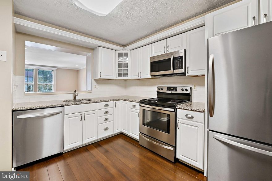 Gorgeous Featherhill home with newly renovated kitchen and basement! The entry level  features a spacious living room with hardwood floors, recessed lighting, crown molding, and opening to kitchen. White raised panel cabinets, granite counters, subway tile back splash and stainless steel appliances in the kitchen. Sliders to a private fully fenced backyard. The upper level has two good sized bedroom and full bath. The basement is finished with new LVP flooring, full bath, exit to the yard and storage room.