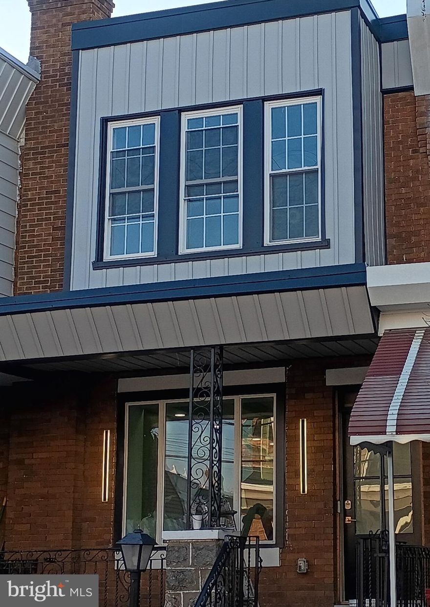 Welcome to 1320 N. 26th Street, a fully renovated, modern, and thoughtfully designed townhome located in the heart of Brewerytown, one of Philadelphia’s fastest-growing neighborhoods. The home features a bright, open-concept layout on the main level with plenty of recessed lighting which flows seamlessly into a contemporary kitchen with all new cabinetry, granite countertops, and stainless steel appliances. The kitchen island also features an integrated glass fireplace! Enjoy the exposed brick in the living room space complete with a unique, modern tray ceiling design. This home also features hardwood flooring throughout. The home heating and cooling provided via the ductless mini split systems that can be adjusted to individual comfort levels. Upstairs find three elegant bedrooms with recessed lighting and ceiling fans, and a contemporary hall bath. The primary bedroom has plenty of natural light, another glass fireplace, and a tray ceiling as well. Below, in the lower level, you’ll enjoy the convenience of a finished basement with another full bath adding an additional 460 square feet, perfect for entertaining or relaxing. Total finished square footage is 1,408 square feet.  Ideally located near Fairmount Park, museums, many neighborhood attractions, numerous pubs, breweries,  restaurants, and public transportation, with convenient access to Center City, major universities, and all highways. Come and experience all the amenities and workmanship this beautiful townhome has to offer! 
Seller is a licensed real estate broker.