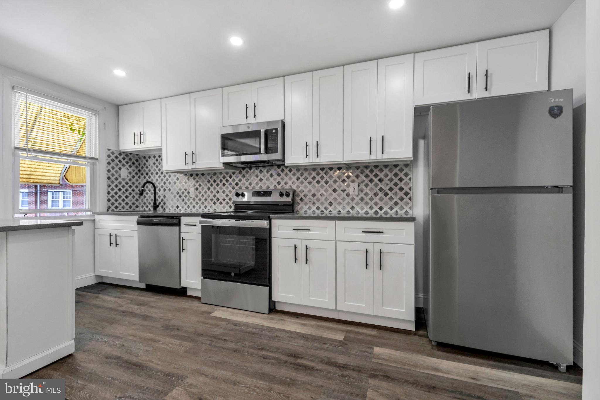 Welcome to 312 Golf Road! Newly renovated home situated in Darby, across from Mercy Hospital. Open kitchen with modern cabinets, quartz countertop and new appliances. High quality backsplash and recessed lights. Central air-conditioning, heat pump. Front yard and very convenient location with easy access to Philly and the Lansdowne train station