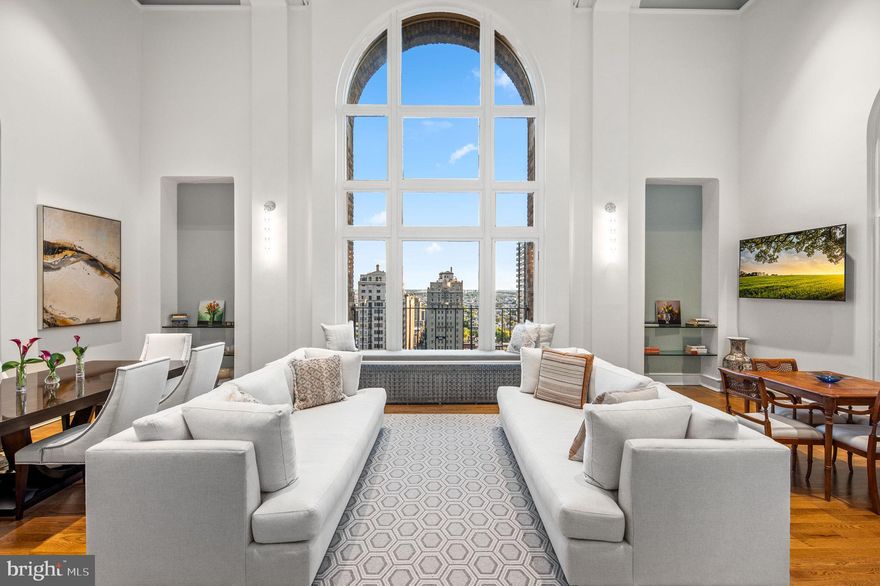 High above Rittenhouse Square, this one-of-a kind, bi-level, 3420 sq ft Penthouse has been fully renovated, with 4 bedrooms and 4.5 bathrooms. This home is completely reimagined by award-winning architects, Kass & Associates, Spogue Kitchens and Bath, and construction by Weaver Luxury Living. The grand living room boasts an 18-foot beamed ceiling and a majestic arched window overlooking the park. A focal point for the room is the original architectural fireplace with marble surround. Double arched doors on each side of the living room open onto charming balconies with spectacular views of the park and beyond. A large archway from the living room leads to an elegant Chef's kitchen with Wolf, Subzero and Cove appliances, custom cabinets made by Artcraft, leathered granite countertops and backsplash.  An oversized island anchors the space, providing ample room for meal preparation and casual dining. The spacious kitchen features an additional sitting area, also perfect for a dining table. The primary suite conveniently located on the first floor includes a spa-like ensuite bath with floor-to-ceiling marble, a soaking tub and a step-in shower. Adjoining the bath is a large walk-in closet with custom cabinets and a well-appointed laundry area with an entire wall of built in cabinetry. Completing the first floor is a marble powder room. On the second level, there are three generous sized bedrooms, each with an ensuite floor-to-ceiling marble bathroom and walk-in closet. This level also includes a second laundry and an overlook of the great room with stunning views through the signature window.  19D & 20D represents the height of luxury and modern living, with solid oak floors, fire sprinklers throughout, multi-zoned HVAC, and AcoustiBlok soundproofing. A ground floor deeded parking space is available for purchase at 2020 Walnut Street. The Rittenhouse Plaza is a pre-war building, overlooking Rittenhouse Square where one is amid the latest trending restaurants, casual eateries, upscale shopping, museums, and so much more. Residents enjoy a 24-hour concierge, a lush courtyard garden, and all of the fabulous perks and conveniences of its Rittenhouse Square location. The building is maintained beautifully, and the staff is very professional and on hand. It’s an ideal place to call home! The monthly co-op fee includes real estate taxes, Fios cable, internet, heat, water, sewer, and building maintenance.