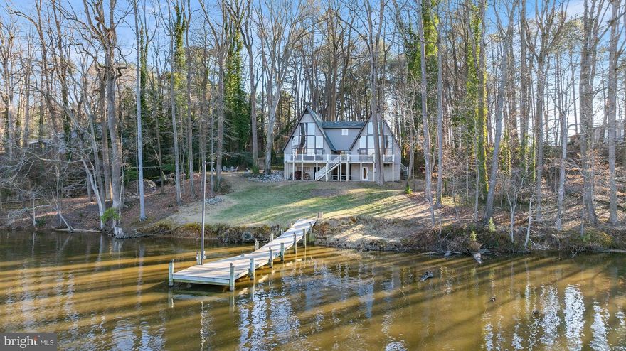 Nestled on over two scenic acres along the Tuckahoe River, Twin Peaks is a stunning mid-century modern home designed to capture breathtaking water views from every angle. Thoughtfully renovated, this 4,800+ sq. ft. retreat blends timeless elegance with modern luxury.

The home features three spacious bedrooms, each with its own private en-suite bathroom for ultimate comfort and privacy. The primary suite is a true sanctuary, boasting floor to ceiling windows and ensuite bathroom with a custom walk-in shower. Throughout the home, hardwood floors add warmth and sophistication, complementing the open and airy design.

At the heart of the home, the chef’s kitchen is both stylish and functional, featuring a large island, granite countertops, and stainless steel appliances. Multiple sunlit living spaces provide the perfect backdrop for entertaining or simply relaxing while taking in the tranquil waterfront setting.

The lower level offers a dedicated game room and media area, making it an ideal retreat for guests or family fun. Step outside to enjoy private dock access with electric service, perfect for boating, fishing, or just unwinding by the water. This home comes fully furnished!

This is one of Talbot County’s best waterfront values—don’t miss your opportunity to make it yours!