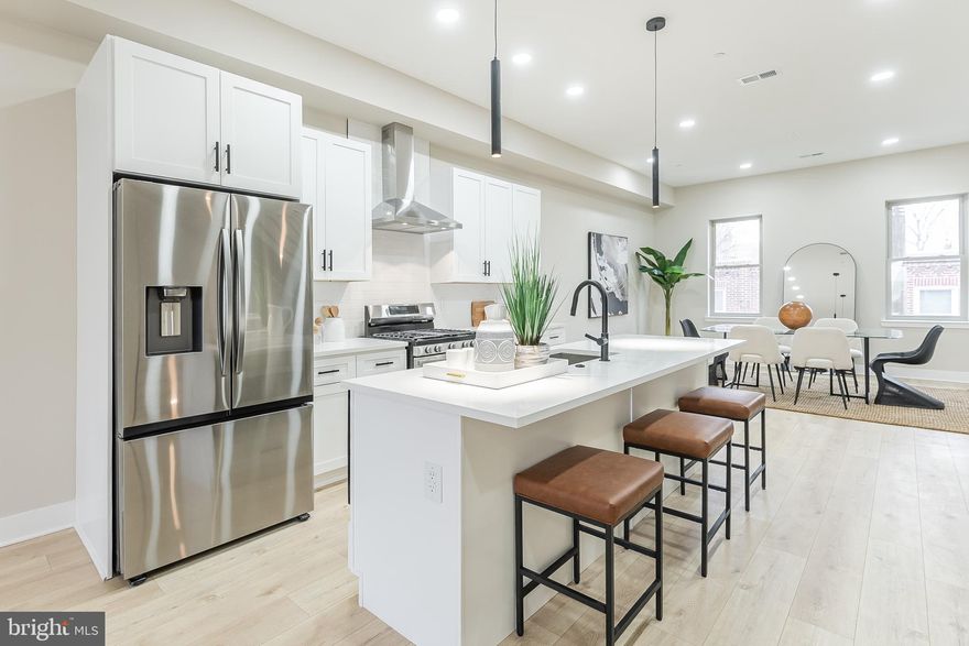 Welcome to Mercer Street Place, nestled in the heart of Port Richmond, Philadelphia. These brand-new constructions offer the coveted FULL 10-year Tax Abatement Program alongside the convenience of secure off-street parking. Anticipated for delivery in June/July 2024, these homes are designed to elevate your lifestyle. Step through the front door off Mercer St into a welcoming vestibule and hallway leading to the first ensuite bedroom, complete with a full bathroom—an ideal retreat for guests or household members seeking privacy. Continuing down the hallway, you'll encounter a coat closet before reaching the flexible rear room, perfect for use as a den, a potential fourth bedroom, or a home office. Venture outside through the rear door to access the parking area and ground floor outdoor space, which can be fenced off to create a private oasis beneath the second-floor decking. Descend to the basement, offering a fully finished space equal in size to the first floor, ideal for a home theater, second living room, or game room. On the second floor, the open-concept layout seamlessly integrates the living room, kitchen, and dining area, facilitating effortless entertainment and maximizing space utilization. The spacious kitchen boasts ample storage, an island seating area, and direct access to the expansive rear deck—a perfect outdoor retreat. Ascend to the third floor to discover two bedrooms, one at the front and one at the rear, along with convenient laundry facilities. The front bedroom features an ensuite bathroom, while the rear bedroom offers a generously sized owner's suite complete with a king-sized bed space and a luxurious owner's bathroom featuring a dual vanity sink and a glass-enclosed shower. Finally, ascend to the rooftop deck, offering breathtaking views of the Philadelphia skyline, Benjamin Franklin Bridge, Campbell Square Park, and the iconic Roman Catholic Church at Allegheny Ave and Thompson St. Don't miss the opportunity to experience these exceptional homes firsthand—schedule your appointment today and take advantage of the FULL 10-year Tax Abatements. Anticipated delivery is June/July 2024. Photos are of completed homes where buyers were given the option to choose finishes. Not all homes are finished the same.