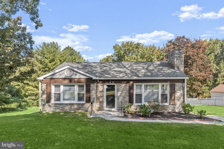 Beautifully renovated, this 3-bedroom, 2-bathroom rancher is ideally situated on a generous half-acre lot in the highly sought-after Perry Hall area. Upon entering, you'll be immediately charmed by the airy and sunlit living room, featuring rich hardwood floors and a stone-surround wood-burning fireplace that extends a warm welcome to all. Follow the inviting neutral color palette to the dining area, perfect for hosting festive gatherings, seamlessly flowing into the gourmet kitchen. The kitchen boasts stainless steel appliances, wide plank wood flooring, crisp white cabinetry accented by matte black hardware, and stunning quartz countertops with a complementary backsplash. The primary bedroom is a serene retreat, with a breezy ceiling fan and gleaming corner windows. A second spacious bedroom and a full bath with timeless ceramic tile surround provide comfort and convenience. For those who enjoy sports and entertainment, the expansive recreation room is the ideal space to cheer on your favorite team during the big game, or you can retreat to the private lower-level bedroom. This level is completed by a full bath, a laundry area, and access to the garage.  Outdoor enthusiasts will appreciate the expansive covered patio, perfect for hosting Maryland-style crab feasts!  Ample parking space is available with the U-shaped driveway and detached garage. The location offers a wealth of recreational opportunities, including nearby Honeygo Regional Park, Gunpowder Falls State Park, Loch Raven Reservoir Park, and the Mount Pleasant Golf Course. You'll also find a wide variety of shopping, dining, and entertainment options in the nearby White Marsh and Towson areas. Convenient access to major commuter routes such as I-95, I-695, and US-1 adds to the appeal of this home. Don't miss the opportunity to make this home yours!