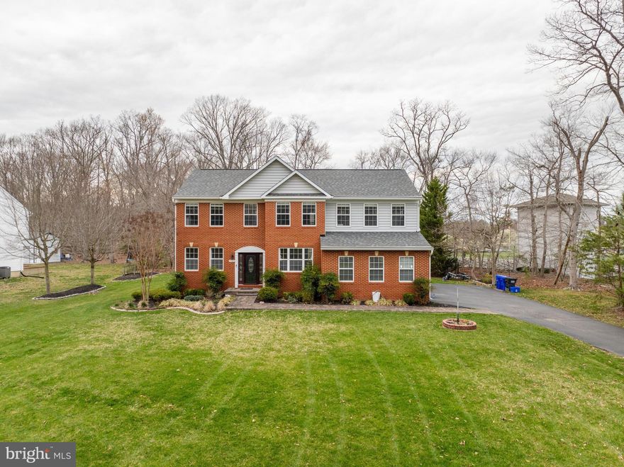 Welcome Home to LaPlata ! This large 4200sqft Brick front colonial is well cared for, and it shows, NO HOA !  Check out the  large lawn with in-ground sprinklers in the front, back, fresh flowerbeds, extensive landscaping, an Elegant Brick walkway Takes you to the front Entrance. The main level of the home is open and spacious,  Beautiful hardwood floor in foyer, formal dining room, formal living room, office, powder room, and updated kitchen overlooking the expansive 2-story family room with  fireplace. Kitchen features stainless appliances, granite tops, granite backsplash,  generous sized Island, and a walk-in pantry. No Shortage of cabinet space here, this has Cabinet space for days! The French doors off kitchen leads to the concrete and paver back patio overlooking a private and wooded backyard. Upstairs includes spacious Master bedroom with high ceilings, walk-in closet, Master bath attached with double sinks, and ornate tilework, Separate shower, and also a soaking tub. Upstairs also has 3 Large bedrooms, a hallway bath with double sinks, and did I forget say Upstairs laundry?  This home also includes a large  basement with a bath rough-in, Ready to be your new home theatre, or game room!  Basement also has separate entrance/exit. The home was Freshly painted,  carpet is new.  New washer and dryer 2024,  Recent roof  with architectural shingles and seamless gutters, New HVAC system  Replaced 2022,  all this and  included pictured shed. This one has it all, and more.  Schedule your showing today!