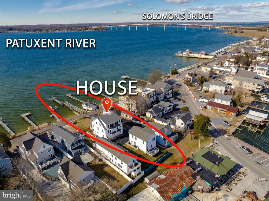 Waterfront Elegance on Historic Solomons Island. Welcome to Solomons Island, Maryland—a charming and historic waterfront community that has been an active seaport since the 1600s. Nestled at the confluence of the Patuxent River and the Chesapeake Bay, Solomons Island has long been home to ferries, floating theaters, and a vibrant maritime heritage. Today, it boasts a collection of exquisite residences that embrace the island’s unique character and lifestyle. We are proud to present one of these exceptional waterfront estates—a stunning home perched on a gentle knoll overlooking the Patuxent River, Solomons Harbor, and the iconic Thomas Johnson Bridge. This remarkable property offers a private deep-water pier with a specialized bar, perfect for enjoying a sunset cocktail. Complete with a boat lift and kayak ramp, this estate is designed for waterfront living at its finest. Inside, you’ll find  six bedrooms, each with breathtaking views of the river, island, or harbor, and 5.5 elegantly appointed bathrooms. Two luxurious owner’s suites feature spa-like EnSite baths, ensuring comfort and privacy. The main level is an entertainer’s dream, offering a spacious living area, an expansive chef’s kitchen with top-of-the-line finishes, a formal dining area, and a butler’s pantry for seamless hosting. Beyond the main house, a detached two-car garage includes a fully furnished one-bedroom, one-bathroom apartment suite. This private retreat boasts its own deck with sweeping views of the Patuxent River and Solomons Harbor, making it ideal for guests or an income-generating opportunity. On the second level of the main residence, four additional bedrooms—one being an owner’s suite—are complemented by beautifully appointed bathrooms. No need to take the stairs—the home’s elevator provides effortless access to all three levels. The third floor is truly spectacular, featuring a spacious great room, an entertainment bar, a cozy sitting area with panoramic views, and a stunning lanai overlooking Solomons Harbor. Recent upgrades to this Victorian-style contemporary home include a tiled front porch with breathtaking views of the river, pier, and bridge—an idyllic spot for morning coffee or sunset drinks. Two expansive rear decks, accessible from two of the  bedrooms and the third-floor great room, provide additional outdoor spaces to soak in the waterfront ambiance. Other updates include new flooring, upgraded bathrooms with glass-enclosed showers, modern lighting fixtures, and ceiling fans throughout. Located on a peaceful, one-way street, this estate offers a spacious driveway with ample parking and easy access to Route 4, connecting you to major destinations:
   •   1 hour 15 minutes to international airports
   •   1 hour 20 minutes to Washington, D.C.
   •   1 hour to Annapolis
Solomons Island is known for its vibrant waterfront lifestyle, offering an array of waterfront restaurants with live entertainment, charming bars, museums, and a scenic boardwalk that stretches the length of the island. Adding to its allure, the detached suite generates between $25,000 - $35,000 per year in rental income, making this a solid investment in both luxury and lifestyle. This is a rare opportunity to own a distinguished waterfront estate on historic Solomons Island. Don’t miss the chance to make this unparalleled property your own.
