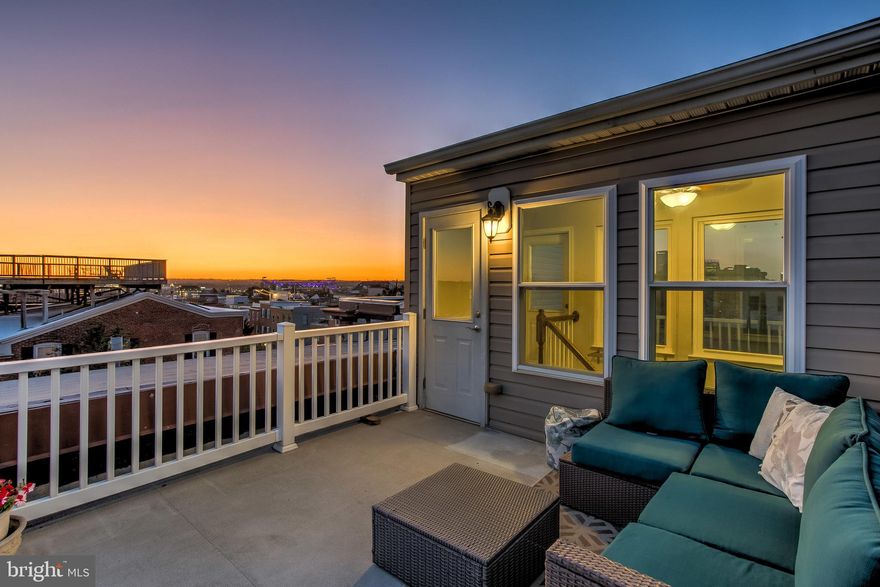Welcome to 401 East Fort Avenue in Federal Hill! This 3-story 13-foot-wide rowhome offers 4 bedrooms plus an office (all above grade), 2.5 bathrooms, 1 car parking, and 3 roof top decks with incredible 360-degree views of the Inner Harbor, Skyline, Domino Sugars Sign, Stadiums, Riverside Park, and Key Bridge! Enter the main level and discover a large living room with hardwood floors and exposed brick followed by a separate dining room, kitchen, and powder room.  The extra-large lot (113' deep) allows for a fenced patio & garden space off the kitchen plus a parking pad. The second level offers 3 bedrooms plus an updated full bathroom. The third level is a private retreat for the owner that includes a large bedroom suite with plenty of closet space, a massive spa-like bathroom, a private office, and access to a balcony. To top it off, the fourth level doghouse provides access to two more spectacular roof decks that are perfect for relaxing, entertaining, and gardening. Additionally, the home provides an abundant amount of storage in the unfinished basement plus secure storage along the house that is perfect for a bike or kayak.