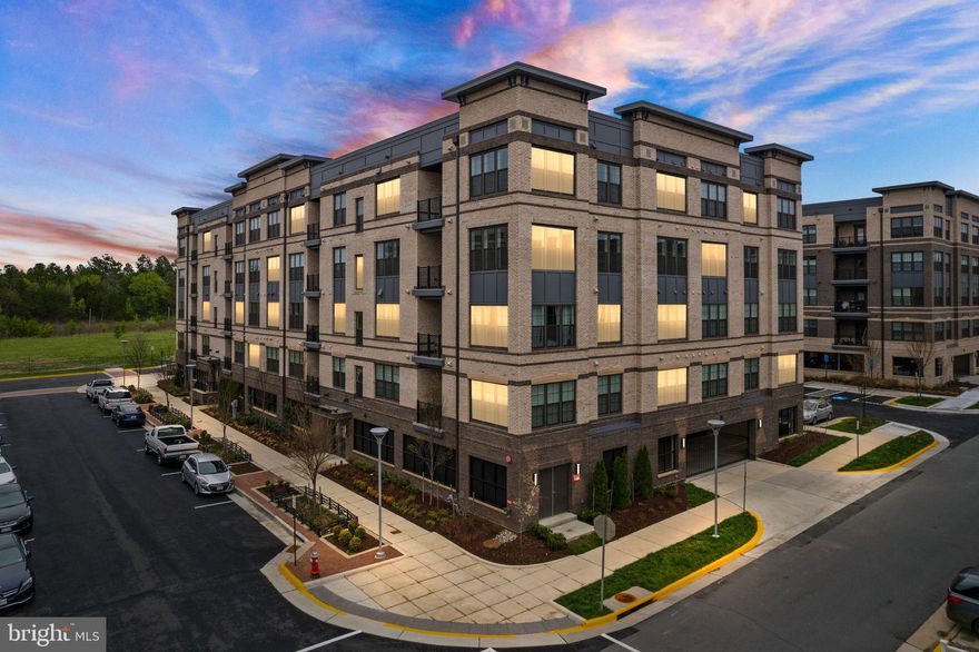 *VA Assumable Loan Available at 2.5%!  Buyer does NOT have to be a veteran to assume. * Penthouse "Ava Model" corner unit condo with soaring 9 foot ceilings and beaming natural light from the Southern exposure,  just 2/3 mile walk to Innovation Center Metro Station (silver line).  Current owners spared no expense on choosing over $50k on interior upgrades (upgraded kitchen, bath, lighting/electrical, and AV)and lot premium for the best view in the building, along with a tandem 2 car parking spot ($18k upgrade!) in the secured parking garage.  The gourmet kitchen features 42" classic white cabinets with under cabinet lighting, premium kitchen aid stainless steel appliances, an expansive island with seating for 4, white quartz countertops, and a double door pantry.  Large living room with ceiling fan on remote and dining room are open to the kitchen. Balcony off the kitchen.  Custom wainscoting added throughout the entrance and living room.  Gorgeous timeless medium tone hardwoods in the common areas with cozy carpet in the bedrooms.  Primary bedroom suite features a ceiling fan on remote, large walk-in closet and ensuite bath with premium upgrades including walk-in shower with two shower heads plus a handheld shower wand and bench, frameless shower door, premium tile,  quartz countertop, and additional storage cabinet.  Additional second bedroom with ceiling fan and large 2nd full bathroom also with upgraded finishes.  Laundry room with cabinets and front loading whirlpool washer and dryer.  Guest parking along the building with 2 EV chargers, or bring along your charger and install it in the garage at your spot! Community amenities include a dog park, tennis courts, basketball courts, soccer field, and covered pavilion. More shopping and dining than you can imagine with Woodland Crossing just 1 mile away and Reston Town Center just 3 miles away. Dulles Airport 3 miles away.