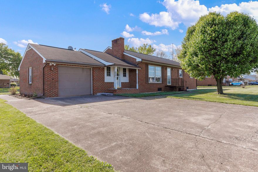 Pending release - buyer financing fell through. Priced to sell - Welcome home to this well-maintained brick rancher home with large lot, attached garage, covered breezeway, and single-level floor plan.  Updates include replacement windows, carpeting, and luxurious main bath.  Large windows offer ample natural light, and a flowing floor plan creates that cozy feeling of home.  A large, unfinished basement provides ample area for additional storage and workshop.