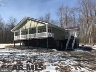 Secluded beautifully kept 2 bedroom 2 bath home located in between Black Moshannon State Park and Philipsburg, 25 minute commute to State College , 20 Minutes to Clearfield. Located next to more than 31000 acres of State Game Land this 2013 home features a large eat-in-kitchen tons of cabinet space and beautiful granite counter top, stainless steel appliances, 2 bedrooms and 1 bath upstairs with outside deck access with an outside shower. Ample size laundry and full bathroom in the fully finished basement area which features a Huge Family room. Outside you'll find a beautiful wooded 3.41 acres. This home is magnificant! Come take a look!