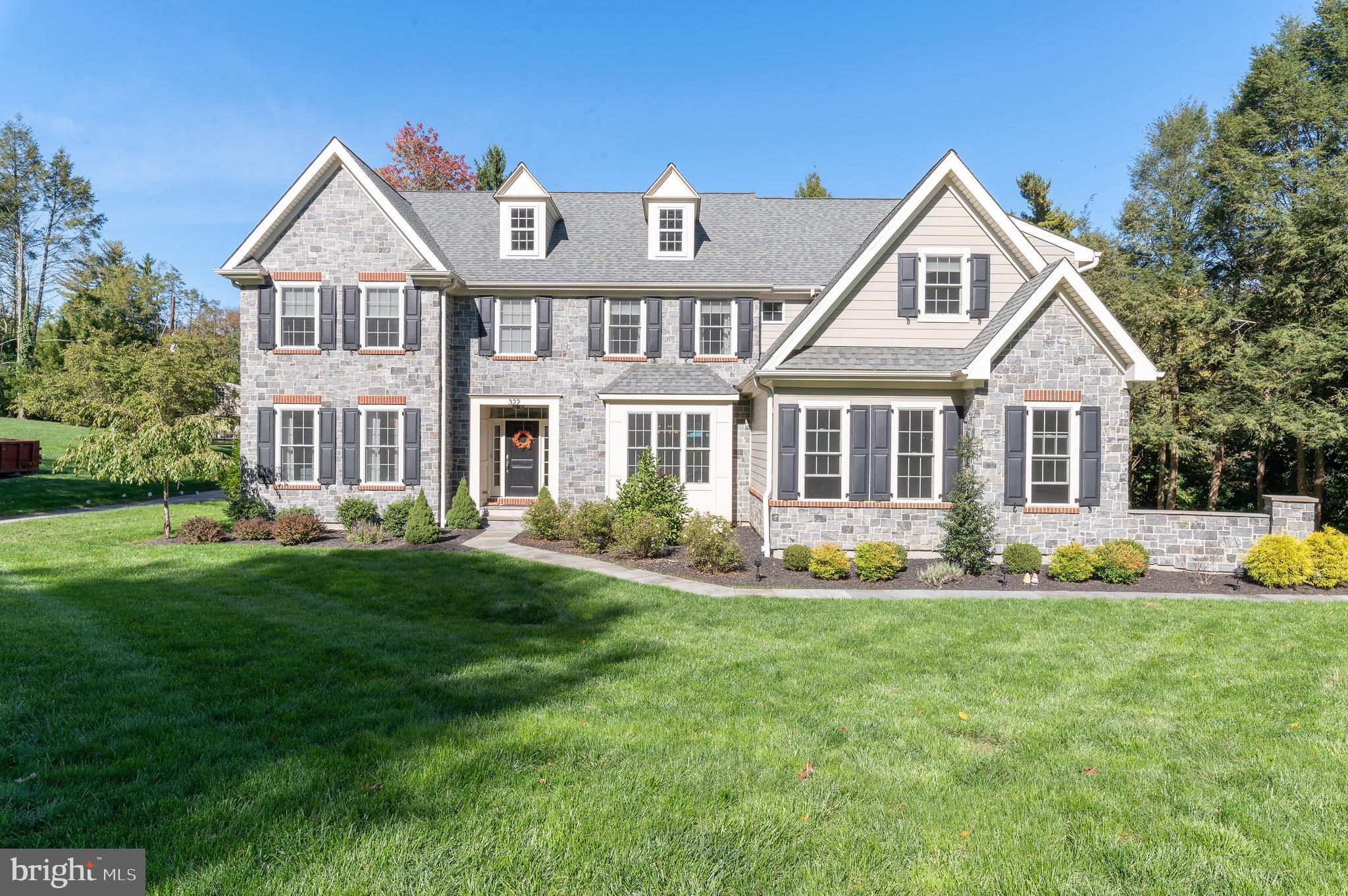 Welcome Home to 322 Greenbank Road! This stunning newer construction home will impress at every turn. Enjoy an open yet traditional layout with incredible finishes, custom millwork and high end design. Enter through the front door into the expansive foyer which is flooded with natural light and gleaming hardwood floors. You will find the formal living room with a fireplace and large yet intimate dining room flanking this beautiful entry. The heart of the home is the incredible gourmet kitchen with custom cabinetry, a large island, marble backsplash, luxury appliances and a breakfast room that overlooks the beautiful backyard. Just off the kitchen is the perfectly placed and comfortable family room with another fireplace. The first floor also has a mudroom just off the attached 3 car garage, 2 powder rooms and an office that is tucked away for privacy and perfect for working from home. Upstairs you will find the generously sized master bedroom retreat with a luxurious master bath and a huge walk-in closet. There are 4 additional bedrooms on the 2nd floor as well as 2 more full bathrooms and a fabulous laundry room. The basement is currently set-up as a home gym and offers endless possibilities if you are looking for additional space for your family and friends. The current owners have added additional recessed lighting throughout, a whole house Generac generator, perimeter fencing, extensive landscaping and hardscaping, and a whole house water filter with softener and UV disinfectant system. You will also enjoy the incredible window treatments, draperies and other designer touches that make this home absolutely spectacular. This amazing home is located on the coveted North side of Bryn Mawr in a private yet convenient location with access to the award winning Lower Merion School District, close proximity to the many prestigious private schools along the Main Line, close to public transportation as well as to dining and shopping in nearby Bryn Mawr. This truly turn-key property is not to be missed!