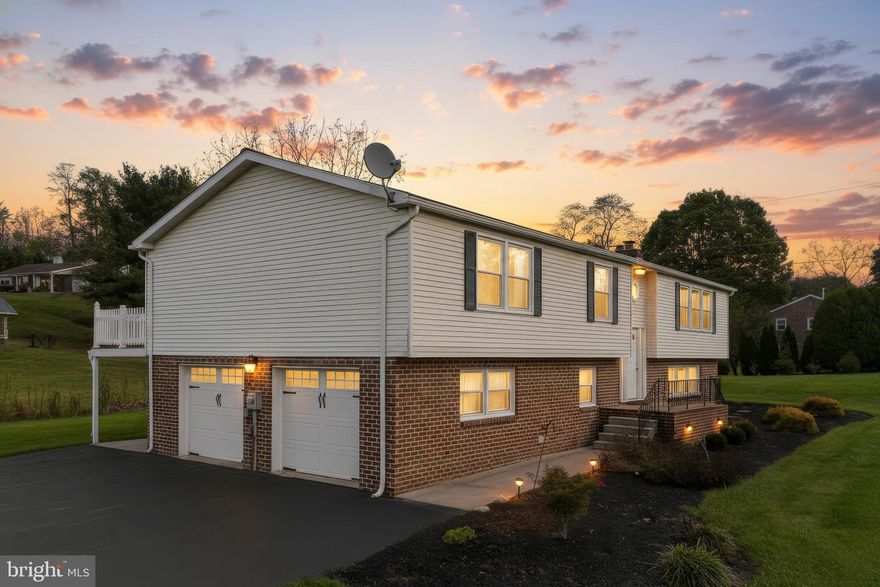 Welcome to 2525 Springwood Rd., a stunningly renovated 4-bedroom, 3-bathroom home offering over 2,500 sq. ft. of finished living space in one of York’s most desirable areas. Every detail has been thoughtfully updated, combining comfort, efficiency, and style.

The exterior features a newer architectural shingle roof, insulated carriage-style garage doors with WiFi belt-drive openers, and all-new ProVia windows, sliding doors, and front entry door. Inside, enjoy updated flooring throughout, brand-new carpet on the lower level, and a modern kitchen with soft-close cabinetry, high-level quartz countertops, glass tile backsplash, and stainless steel appliances.

A highlight of the home is the full-length PVC back deck, accessible from both the living room and primary bedroom. This outdoor space offers excellent privacy, views of the golf course, and breathtaking sunsets—perfect for relaxing or entertaining.

The home features a top-tier 25 SEER Daikin mini-split system for efficient heating and cooling, plus natural gas hot water baseboard heat for added comfort. The walk-in lower level includes a bedroom, full bath, laundry area, storage, and a large living space with a walkout to a covered patio beneath the rainproof deck. Upstairs, you’ll find three bedrooms and two updated bathrooms, including a primary suite with walk-in closet and custom built-ins.

An oversized two-car garage provides ample space for parking and storage. Conveniently located near Springwood Golf Course, restaurants, gyms, and shopping, this home offers the perfect combination of modern upgrades, energy efficiency, and scenic beauty. Truly move-in ready and meticulously cared for—this is one you won’t want to miss!