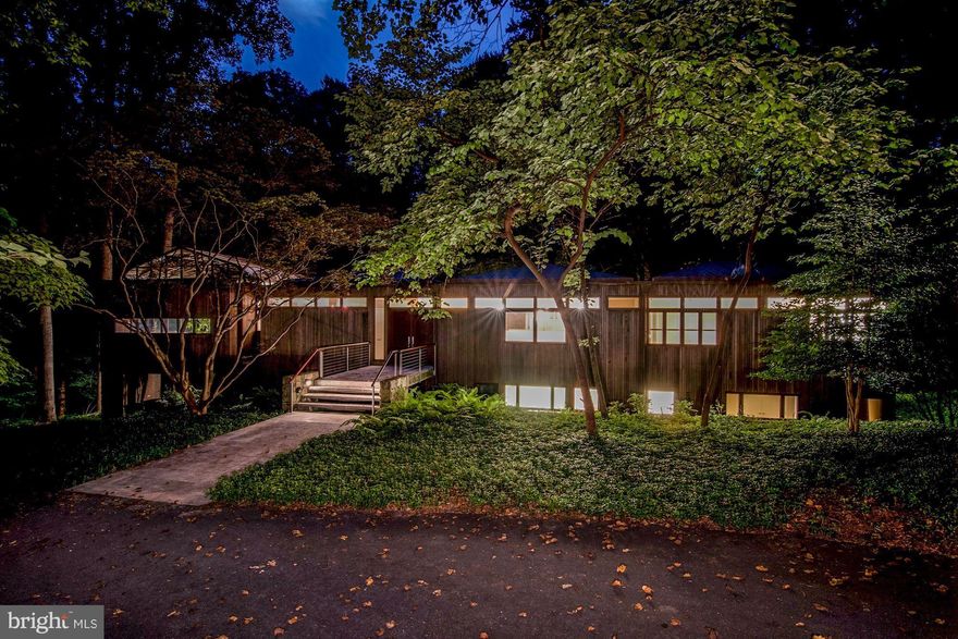 Stunning contemporary on 1.3 acres with easy access to DC and Potomac Village, 270/495.  Extraordinary design of steel, wood and glass.  Main level MBR suite, fully finished walk-out LL, gorgeous wooded views, heated pool, sauna, exercise room, Koi pond and more.  An exceptional house that one rarely finds.