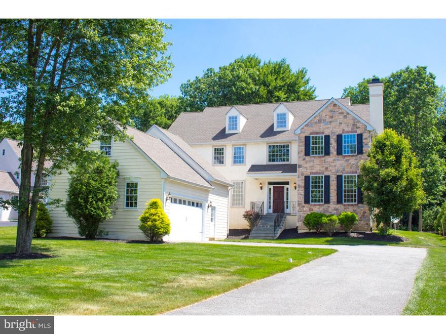 This exceptional home nestled in the private "Enclave at Pleasant Woods" offers a quiet retreat yet easy access to downtown West Chester, major routes, and the Philadelphia airport. The architectural detailing in this home is exquisite, with site-finished hardwood floors, wainscoting, moldings and high ceilings throughout. An eye-catching curved wall provides entry to the elegant formal living room with fireplace that is connected to a bright first-floor office with glass doors. Across the center hall sits a grand dining room with a granite butler's pantry and ample space for a crowd. The back of this home opens completely to a stunning kitchen, breakfast room, and family room ensemble that is very spacious and open but at the same time warm and welcoming. It features a gourmet kitchen with glazed cabinetry, granite countertops, gas cooking, and a large island. There is a dedicated breakfast room with a tile floor, and a step-down family room with a fireplace and built-ins. All of this lovely space showcases beautiful windows that take in a tranquil view of the yard backing to woods. The first floor also offers two powder rooms and a laundry. Upstairs, this home offers a luxurious master suite featuring a bedroom with trey ceiling, sitting room, and a gorgeous master bath with walk-in shower, garden tub and a huge closet outfitted with custom built-ins. The second floor also has curved walls, wainscoting and moldings throughout, decorating the way to three more bedrooms and two more full baths. This home also has a full basement with daylight window ready for your finishing touches. Plus newer utilities and so much more.  Owner has successfully appealed taxes and new assessment will be in effect for 2017. This home is a true gem?make your appointment today!