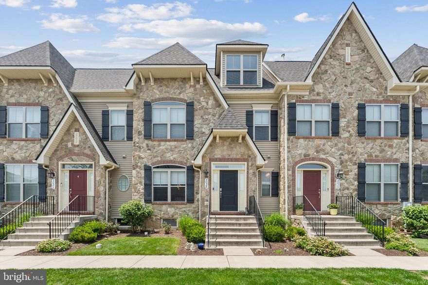 HUGE PRICE REDUCTION! Act now to grab this beautiful home! 

Over 4,000 square feet in this spectacular luxury townhouse in sought-after Worman's Mill! This home is the large Beauvais model with optional 4th floor!

Welcome to this beautifully upgraded Beauvais luxury townhouse, built in 2018 and featuring the optional added loft for exceptional living space and versatility. This spacious home offers elegant finishes, thoughtful upgrades, and a layout designed for both comfort and entertaining.

Step inside to find gorgeous oak hardwood floors and an expansive open-concept main level enhanced by ceiling fans on every floor for year-round comfort. The entry and staircase feature upgraded iron balusters with a wooden handrail, adding a touch of modern elegance to the home's timeless design. The gourmet kitchen will impress with GE stainless steel appliances, granite countertops, a large center island with pendant lighting, soft-close cabinetry, a 5-burner gas cooktop, double wall ovens, and an abundance of storage—including a custom-built stylish coffee bar with locking fridge and additional cabinets. 

Upstairs, enjoy an amazing primary suite featuring two vanities, a soaking tub, and an oversized spa-style shower with bench seating. Closets include custom organizers for maximum efficiency. This level also offers two additional generously sized bedrooms, a full bathroom with a tub and dual sinks, and a conveniently located laundry room with built-in cabinetry and a stylish sliding barn door. One more level up, a spacious loft provides the perfect flexible area for a home office, playroom, or additional lounge space.

The finished basement boasts a full bathroom, a large bonus room (currently used as a guest bedroom) with two ceiling fans, a spacious rec room with an egress window for natural light and safety, and lighted storage under the stairs. The storage room also includes a convenient wash sink and motion-activated lighting.

Tech-savvy upgrades include two-stage heating/cooling with dual thermostats, TV outlets positioned behind each TV for a clean, wire-free look, and recessed lighting throughout. Fresh paint throughout and nearly-new condition make this home truly move-in ready.

Enjoy the low-maintenance backyard with beautiful hardscaping, offering a private, peaceful retreat—no lawn care required! An external natural gas line makes outdoor grilling convenient, eliminating the need for propane tanks. A two-car detached garage offers easy private parking.

Located in the desirable Worman’s Mill community, you'll have access to resort-style amenities including a clubhouse, fitness center, pool, tennis and pickleball courts, basketball, and a walkable village center with shopping and dining (new village shops just steps away!). Easy access to Route 15 and close proximity to Wegmans, restaurants, and downtown Frederick make commuting and daily errands a breeze.

Don’t miss this opportunity to own this spacious, updated model in Worman’s Mill with unmatched space, style, and convenience!