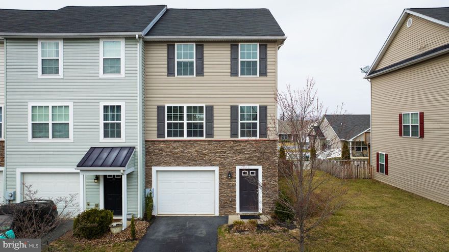 **Please be advised that the Open House has been cancelled due to the Seller's acceptance of a ratified contract. Seller will consider back-up offers, with a scheduled confirmed showing appointment. 

Welcome to this beautifully updated and well-maintained 3-level end-unit townhome! This home boasts recently updated flooring and fresh paint throughout, creating a modern and inviting atmosphere. As an end unit, you'll enjoy extra natural light from the additional windows, highlighting the spacious living areas. The oversized, fenced-in yard offers plenty of room for outdoor activities, and the large rear deck is perfect for relaxing or entertaining. Need extra space? The lower level features a convenient office area, ideal for remote work or a study. With a one-car garage for added convenience, this home is ideally located near shopping, restaurants, and offers excellent commuter access. Don’t miss the chance to make this stunning home yours!