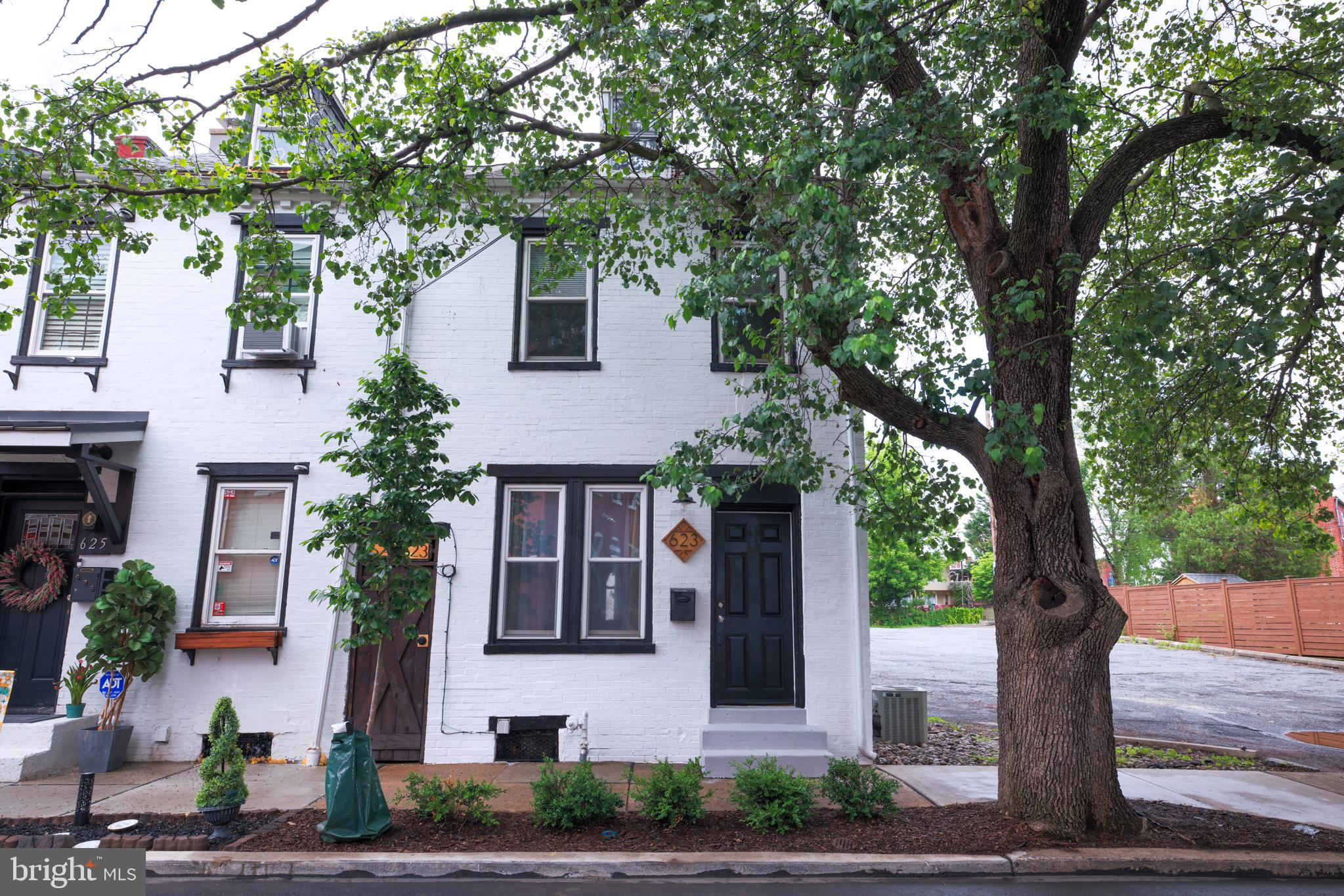 Welcome to 623 Marietta Avenue! An immaculate end unit in Chestnut Hill located only one block away from the Chestnut Hill Coffee Shop! This recent flip with additional upgrades features 4 bedrooms, 1.5 bathrooms, beautiful oak inlays, and a luxury backyard patio with chic white floral beds, white hydrations tree, white hydrangeas bush, and other greenery. It is a great outdoor living space to barbeque and hang out with friends and family. When you enter the home, you are greeted with an open living room with original hardwood floors. The natural light pours in the large windows showering all of your guests. Continue to walk into the home and you are greeted with the dining room fit to host all family and friends. The galley kitchen has upgraded countertops, gas cooking, and plenty of room to store everything needed for a full kitchen. At the end of the kitchen is the half bathroom and laundry room combination. Be sure to give the puppies a good wash in the sink perfect to help the furry friends. When you walk up the stairs to the second floor, you find the primary room that faces the front of the home. Double doors his and her closets make the space complete. Next to the primary is bedroom two fit for an office, bedroom or storage room. Walking towards the rear of the home, you pass the beautiful oak inlays for all of your reading needs. The full bathroom is to your left with an updated sink and floor. Bedroom number three is at the rear of the hallway and offers plenty of light and serenity. When you make your way to the third floor, you are greeted with a large carpet room perfect for any game room or second office. Behind the backyard oasis, are two off street gravel parking spaces that come with the home. The basement is unfinished and is great for extra storage needed. The home is a short walk to the downtown area including the Fulton Theater, Central Market, and award-winning restaurants including Passerine. Chestnut Hill is a great neighborhood for walking or strolling with the puppies. Be sure to see this one-of-a-kind end unit stunner before it is too late.