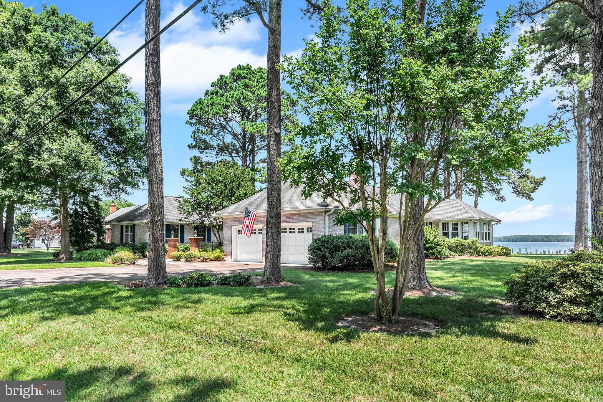 Welcome to this stunning brick one -story house on Riverview Terrace that you've always admired. From the moment that the front door opens, you will be captivated by the breathtaking views of the Miles River. This home offers an open floor-plan with a large great-room, dining room; kitchen, a primary bedroom suite , 2 guest rooms sharing a full bathroom,, an office and a powder room. Lovely hardwood floors, 2 fireplaces , extra- wide hallways, and numerous waterside windows/doors are some of the features that make this home special. This property, conveniently located on the 900 block of Riverview Terrace , provides easy access into downtown St. Michaels. Public water, public sewer, no town taxes, an attached 2 car garage, a completely insulated attic, a new stone driveway, crawl space with concrete floor, pier, deck, and beautiful landscaping contribute to the desirability of this property. Most furniture will be included with the sale.
