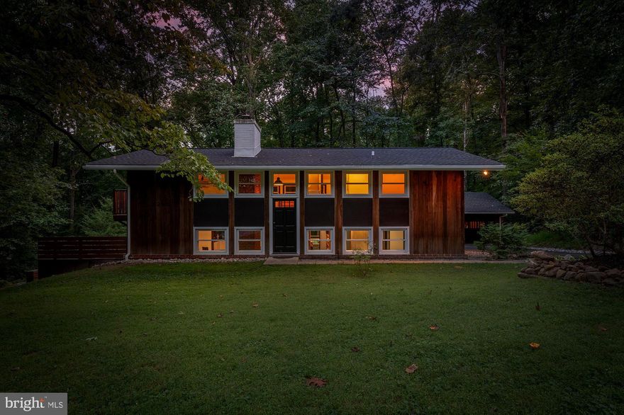 All best and final offers are due by 6pm on Tuesday, September 19th. 

Welcome to 4205 Manorview, a thoughtfully renovated ’Techbuilt’ concept house with incredible attention to detail. Nestled atop 1.6 mostly wooded acres, this mid-century house offers privacy as well as a panorama of the forest from its wrap-around outdoor living space.

The main level of the home welcomes you with breathtaking views of your zen surroundings, as a generous number of windows allow you to take in the park-like beauty from nearly any room in the house! The living area of the house also features concrete floors with radiant heating, slick modern forest green kitchen cabinetry with crisp quartz countertops and new appliances, a wood burning fireplace, as well as an abundance of storage. Walk out to the custom bluestone patio to enjoy your morning coffee, while taking in the tranquility of nature around you.

Second level features gleaming newly refinished Appalachian white oak hardwood floors complementing the nature based synergy of this home, a spacious sitting area, 3 total bedrooms including a large Primary suite with a private balcony. The bathroom is updated with exotic honed marble and a custom vanity perfect for the space. There is roughed-in plumbing in the primary suite for a potential en-suite bathroom.

Unbeatable outdoor space is perfect for family gatherings and entertainment.  Landscaped river stone steps will take you to a secluded fire pit area, with an access to a trail that leads you directly to the Loch Raven Reservoir.
 
The large detached 2 car garage has ample room for storage and features a mechanic’s pit that allows you to wrench on cars or trucks at home! California redwood siding encompasses the house and garage and a brand new architectural shingle roof was installed in 2020.

Located within pastoral Glen Arm in close proximity to Loch Raven Reservoir, walking distance to Bill’s vegetable and fruit farm-stand, and less than 10 min from Boordy Vineyards and Prigel Family Creamery.
