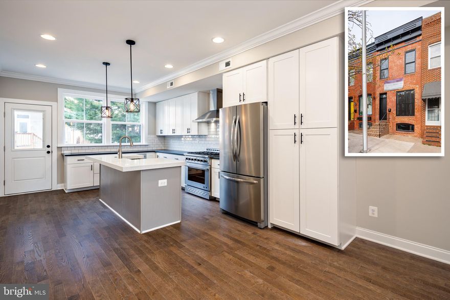 EXPANSIVE & STYLISH 3 STORY RENOVATION W/ 2 CAR OFF STREET PARKING AND INCREDIBLE PANORAMIC DOWNTOWN & HARBOR VIEWS - this new renovation by custom home builder Van Allen Homes boasts a newly added 3rd story & rear addition featuring 3 large bedrooms above grade & an additional office flex club room with hallway full bath on the 3rd level and a wet bar great for entertaining on the rooftop deck. Conveniently located just a short walk to the Shops at Canton Crossing this over 2000 sq ft renovation offers hardwood floors throughout, shiplap wall details, exposed brick, crown molding, large living room, dining room, huge luxurious island kitchen w/ quartz countertops, ss appliances, tile backsplash, custom cabinetry w/ under cabinet lighting leading to easy access 2 car parking pad. Upper levels provide 3 bedrooms with large walk-in closets featuring custom built-ins, remarkable 2nd floor owner suite w/ double bowl vanity, huge walk-in closet and spa-like shower.  Additional amenities include two zone hvac system, large laundry room and hallway access to composite rooftop deck with amazing downtown and harbor views! The finished basement provides you flexibility for the ultimate entertaining space or utilize as a 4th bedroom all while providing additional storage space - builder warranty, schedule your tour today!