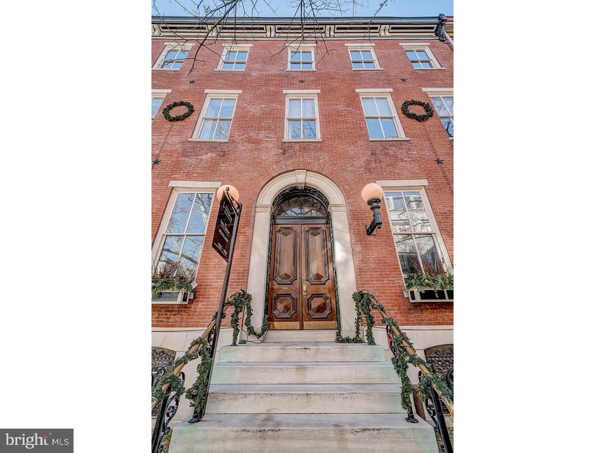 With palatial roots dating back to 1860, this remarkable Rittenhouse residence blends treasured architecture with contemporary luxury. Situated inside a lovingly preserved brick mansion on the historic 20th block of Delancey Place, this immaculate bi-level unit features 15-foot-tall ceilings that sail above the sunlit chef's kitchen, warm living spaces that are lined with oak wood flooring, 10-foot mahogany windows with custom wood shutters, and custom built-ins. The kitchen stuns with features like a Wolfe 6-burner gas cooktop and microwave, Carrara marble countertops, sub-zero stainless steel refrigerator and wine coolers, as well as custom Kahle wood cabinets. The kitchen beautifully flows into the main living area, which highlights a fireplace with a marble mantel and mahogany crown molding. There is a bonus powder room on the main living floor. The magnificent and modern staircase leads you to the two large bedrooms, which both include ensuite bathrooms with radiant floor heating. The master and guest suites are an oasis to relax and recharge, featuring a jet-soaking tub, steam shower, and grand walk-in closets. The master ensuite features a bidet. Samsung washer and dryer is conveniently stored between both bedrooms. Outside, the lush terrace offers space for entertaining and sky-gazing above an enclosed 1-car parking garage. You can also enjoy the finest dining, shopping and arts of Rittenhouse Square, just steps away. Can be purchased with or without parking. There are only 4 units in the building and 4 years left on the tax abatement. Come view this luxurious property for yourself today!