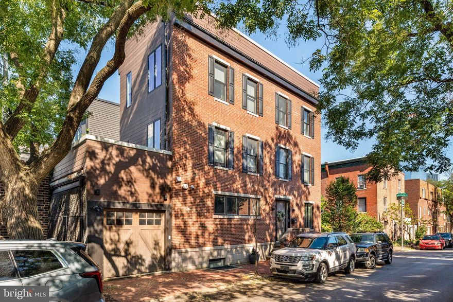 Welcome to this lovely contemporary yet traditional home in the coveted neighborhood of Fitler Square.  Nestled on the corner of a quiet and quaint tree lined street, this home features Garage parking, plenty of living space and a roof top deck with magnificent views of the center city skyline.   It is also in the Greenfield school catchment.  Enter into the bright and open concept Living and Kitchen area.  The Kitchen has high end finishes including Viking appliances, custom cabinetry and quartz countertops.  There is also a center island with counter seating and additional cabinet storage.  Flowing into the living room, you will notice the built-in shelving and cottage shutters on all of the windows to allow light and privacy.  The second floor primary suite is truly a retreat with a private terrace, generously sized walk in closet, en-suite bathroom with dual vanity, oversized shower, and a relaxing soaking tub. The third floor has two additional bedrooms, a hall bath and a laundry room! Going up another level, there is a full size roof deck with panoramic views of center city, great for entertaining and taking in those sunsets! A full sized, finished basement with secondary living space, fourth bedroom and full bath complete this spacious home. Walkable to Fitler Square, Rittenhouse Square, Schuylkill River Park & Trail, UPenn, Penn, CHOP, HUP plus all the restaurants and shops. Readily accessible to Rt.76, 95 & 476.