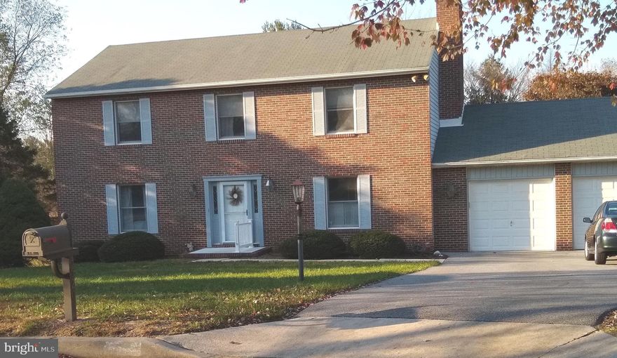 Pretty brick front Colonial situated on a beautiful culdesac lot.