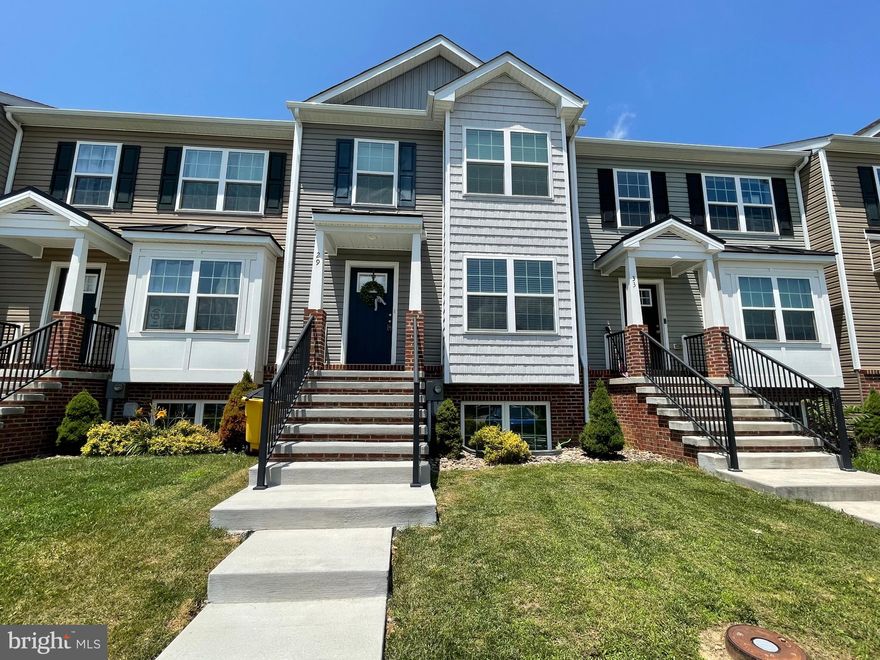 Spacious Townhome in Northern Berkeley County – Ideal for Commuters!

This well-appointed 4-bedroom, 3.5-bath townhome offers comfort, space, and convenience in a prime location. Situated in Northern Berkeley County, you'll enjoy close proximity to I-81, Hagerstown, the MARC Train, major hospitals, and downtown Martinsburg’s shopping and dining options.

The main level features beautiful hardwood flooring, while the bathrooms are finished with tile and the bedrooms offer cozy carpeting. A standout double box bay extends across two floors, providing additional interior space and enhancing the home’s exterior curb appeal.

Upstairs, the vaulted ceiling in the primary suite creates an open, airy feel. The attached primary bath includes a dual vanity, walk-in tiled shower, and a glass shower door for a polished finish.

The fully finished walk-out basement includes a second living area, as well as the fourth bedroom and full bath—perfect for guests, a home office, or additional living space.

This home offers thoughtful design and commuter-friendly convenience—schedule your private tour today!