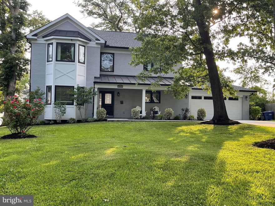 COMPLETE REVITALIZATION IN 2019*Roof Removed and Second Story Added*Marvelous, Captivating Three-Level Home w/Two-Story Bay/Bumpout at Front Elevation*Hardwoods on Main and Upper Levels*Custom Five-Panel Doors and Double Pane Casement Windows throughout*Recessed Lighting*Custom Crown Moldings*9'Main Level Ceilings*Central Hardwood Sectional Staircase* 5EnSuite Bedrooms/Bathrooms*Master Suites on Main and Upper Levels*Laundry facilities on Upper and Lower Levels*Spacious Lower Level Bedroom Suite - great for AuPair, In-Laws and Guests.

Open-Concept Main Level features Designer Island Kitchen with Medallion (soft-close) Cabinetry, Thermador Stainless Appliances, Cooktop w/Pot Filler,  Two Wall Ovens for Microwave, Speed Cooking and Conventional WiFi for Remote Settings, 36 -Bottle Wine Refrigerator, Stainless Steel Sink w/Extendable, Lighted Faucet, French Door Refrigerator/Freezer Bottom w/IceMaker*Electrical Service Popups in Island*Quartz Counters*Pendant Lighting*Custom Backsplash Tiles* Open Dining Concept and Generous Seating adjacent to Kitchen and located at Rear Elevation leading to Stone Patio.

The Large Formal Living Room features a Bay Window Bump -out providing an abundance of natural light
Located at the Rear of the Main Level is a Cozy Family Room with Gas Fireplace flanked by Custom Built-ins and features a mantel with unique tiled surround.  This Room also accesses the Rear Stone Patio creating great flow for Exterior Entertaining.

The Larger of the Two Master Bedroom Suites which is located upstairsboasts an elaborate ElloAllo Shower Bath providing Foot Faucet, Body Sprays, Hand-Held Unit and Rain Unit, all of which can be controlled by Digital Temperature Settings.  Note the His and Hers Walk-in Closets with Custom Built-ins.
Two Additional Bedroom Suites are located on the Upper Level.  One features a Jetted Tub/Shower Unit while the other has Elevated Vanity Vessel and Generous Custom Shower.  A Utility Closet in the Upper Vestibule offers the convenience of hookups for a Stack Washer/Dryer.

A Fully Finished Lower Level can function as an Independent Unit with Outside Walkup Ingress/Egress.  The Recreation Room has a Raised-Hearth Stone Fireplace with Gas Logs.  Speakers are also mounted for addition of an Audio System.  The spacious Wet Bar has Granite Counters, Full Size Refrigerator and Dishwasher.  A 5th EnSuite Bedroom with Shower Bath is adjacent to a Large Exercise/Storage/Media Room.  The Huge Laundry Room boasts Samsung Front Load Washer and Dryer, Utility Sink, expansive Granite Counters with Storage above and  below.

Exterior Features:  Landscape Lighting, Six-Zone Underground Irrigation System, , No-Maintenance Expanded Concrete Driveway, Two-Car Garage with Automatic Opener and Slate Flooring, Underground Utility Service, Covered Slate Porch w/Metal Roof and a Generac 20K Natural Gas Generator.  

In addition, A FIOS System is in place featuring a Video Surveillance System.