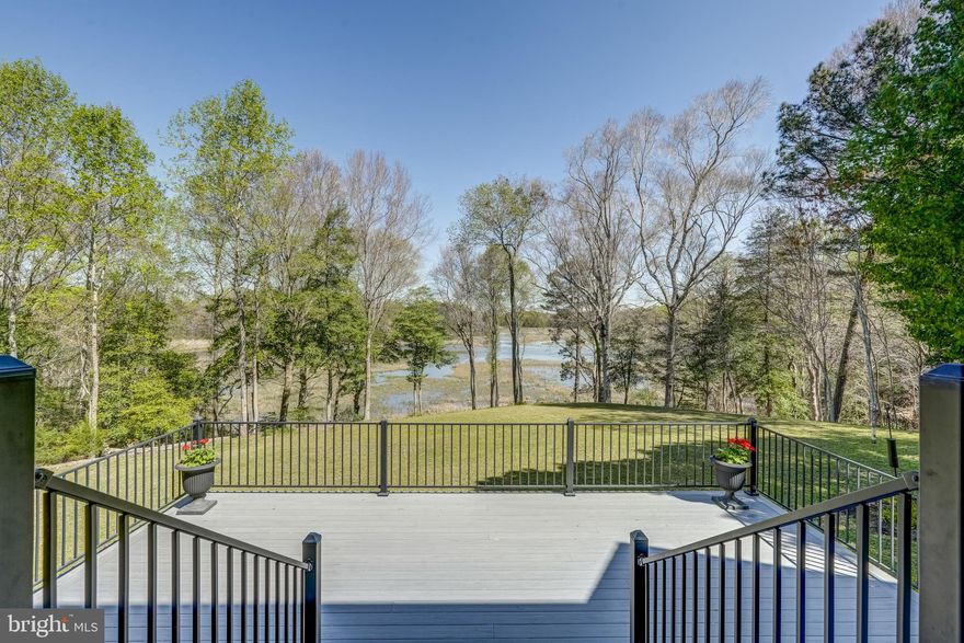 Chippokes Creek Waterfront Home - truly a hidden gem! Nestled on 14 acres along Chippokes Plantation State Park, you will enjoy living in this stunning home and the peaceful, waterfront lifestyle it offers. Whether admiring the spectacular views from the back deck or paddling a canoe down the creek, there is something for everyone! A short drive to the Ferry or to downtown Smithfield, this home combines tranquility with easy access to local amenities.  Property features include a first-floor primary suite with comfortable one-level living, vaulted ceilings, bamboo flooring, expansive views, spacious second floor bedrooms, 3 car garage, and additional rooms well-suited for a home office or fitness center.  Owner updates include a remodeled kitchen complete with leathered granite, 5 burner gas stovetop, built-in cabinets with glass doors, and expanded back deck.   This home is a great place to get away from it all!