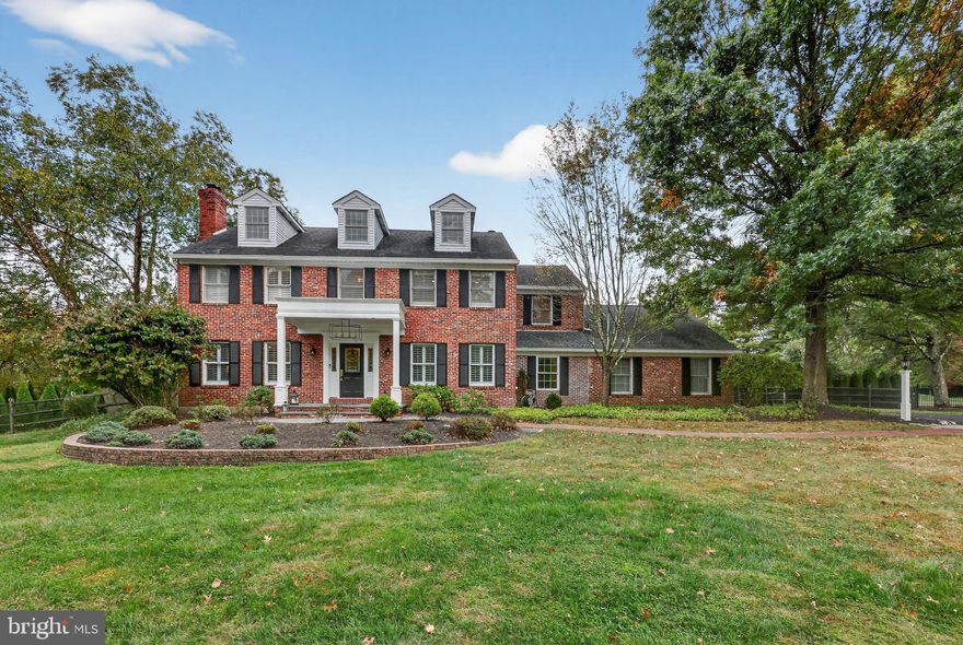 Welcome to 140 Glenwood Drive, a distinguished 4-bedroom, 3.5-bath colonial set on a private .83-acre lot in sought-after Upper Makefield Township. This custom-built residence offers over 3,400 square feet of elegant living space, thoughtfully designed for both everyday comfort and refined entertaining.
Step inside to a grand two-story foyer with gleaming hardwood floors that flow throughout the main level. Formal living and dining rooms showcase timeless details, including crown molding, a wood-burning fireplace, and a built-in corner cabinet. At the heart of the home, the gourmet kitchen adjoins a sun-filled great room, while the inviting family room features a second fireplace, creating a warm backdrop for gatherings. A private main-floor office provides the perfect space for working or studying from home.
Upstairs, the expansive primary suite offers a true retreat with a private sitting area, a spa-like en suite bath, with elegant tub, oversized walk-in shower, heated floors, 2 custom vanities, cathedral ceiling and custom finishes. Three additional bedrooms and a beautifully remodeled full hall bath complete the upper level. The finished lower level provides flexible living space, perfect for a game room, media area, or fitness zone. Step outside to your personal backyard oasis. A covered paver pavilion with fireplace invites year-round enjoyment, while the resort-style in-ground pool, raised spa, and thoughtfully placed pool full bath set the stage for effortless entertaining and relaxation. There is a propane run generator for peace of mind.  Perfectly located in the acclaimed Council Rock North School District, and just minutes from historic Washington Crossing Park, this exceptional home combines privacy, luxury, and convenience with easy access to I-95 for commuting to New York, Princeton, or Philadelphia.