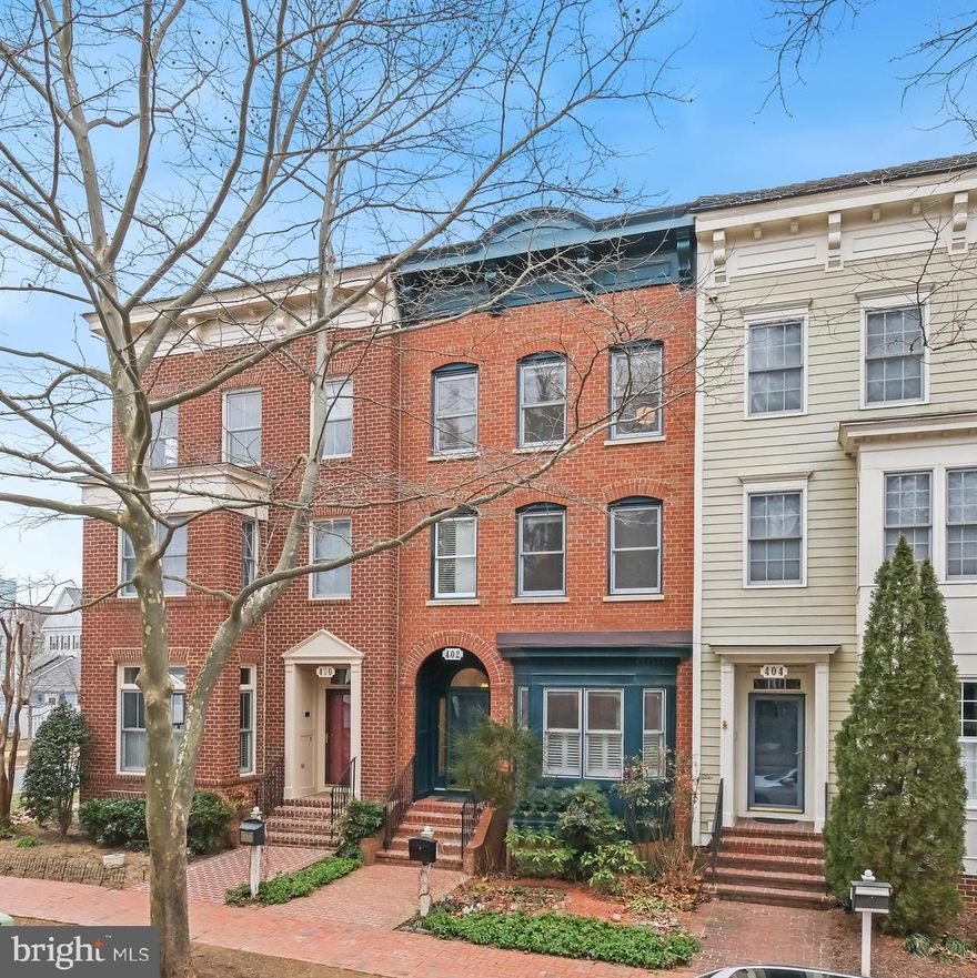 Discover an exceptional opportunity to own a luxurious 4-level Parkwood brownstone, the coveted GEORGETOWN III model, nestled in the picturesque "Old Farm" setting near the Mansion and Arts Barn. Perfectly positioned, this home is also just steps from the Kentlands Green, historic landmarks, and the vibrant "midtown" area with its array of restaurants, shops, and amenities.

This stunning residence showcases a handsome brick facade with a charming bay window and a recently replaced roof, seamlessly blending timeless style with modern convenience. Inside, the main level impresses with soaring 10-foot ceilings, elegant archways, gleaming wood floors, and abundant natural light streaming through walls of windows.

Spanning four levels of luxury, the main level boasts a gourmet kitchen and a cozy fireplace, with a seamless flow to the outdoor living space and a two-car garage. The lower level is an entertainer’s dream, perfect for movie nights by the fireplace, complete with a bathroom rough-in and a spacious storage room.

On the first upper level, you’ll find a serene Owner’s suite featuring a renovated spa-like bathroom, along with a second bedroom that includes its own private, updated en suite bathroom. The top floor offers a private retreat, complete with an additional bedroom suite and a full bathroom—ideal for guests or a quiet escape.

Beautifully upgraded throughout, this home combines luxury, functionality, and an unbeatable location to create the perfect living experience. Don’t miss this rare gem in the heart of Lakelands!