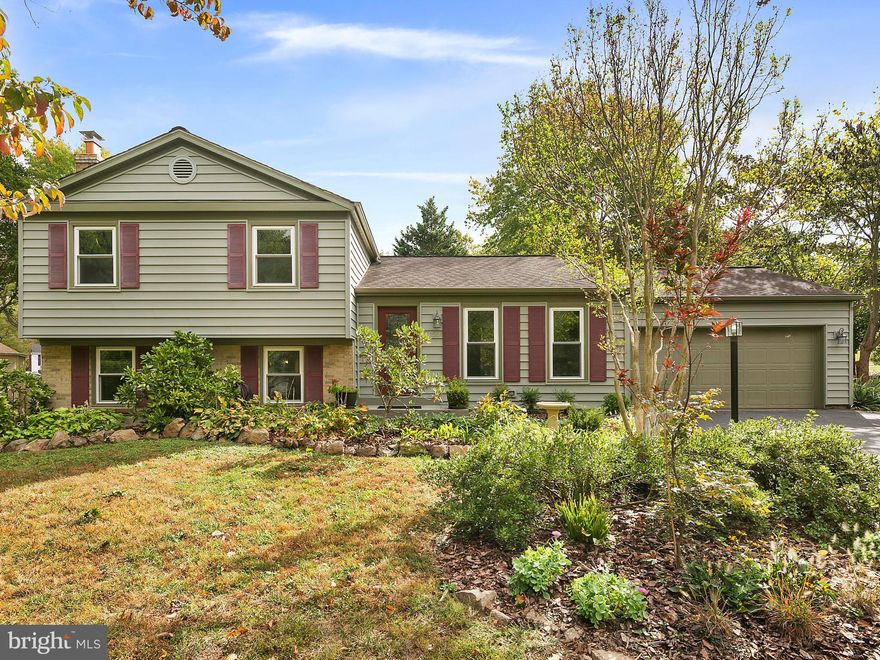 Looking for the perfect home that offers loads of privacy and a park-like back yard with an oversized deck with lots of mature landscaping. Well, welcome home! Terrific curb appeal - tastefully landscaped with flowering bushes and trees - beautiful front door with beveled glass.We offer 4 bedrooms and 3 full baths. The upper level has 3 bedrooms with updated bathrooms, a master bedroom with a ceiling fan,  a remodeled full bath with a skylight for natural light, pedestal sink and newer ceramic tile shower surround. Hardwoods floors are throughout this level. The main level has hardwood floors, living and dining rooms, and an updated kitchen with quartz counter top, stainless steel appliances, French door refrigerator with bottom drawer freezer, ceramic top stove with a built in microwave. The dining room has doors to the back yard and deck - great place to enjoy summer BBQs. The lower level is finished with a family room, a raised brick wood burning fireplace, a full bath and the 4th bedroom. Recent updates include interior painting(19), refinished hardwood floors on main level and upper level(19), new carpet in family room(19), updated baths, vinyl siding(11), AC(11), new upscale front door(11), 6 foot fence(14), triple pane windows(11), and 220 service to the garage.