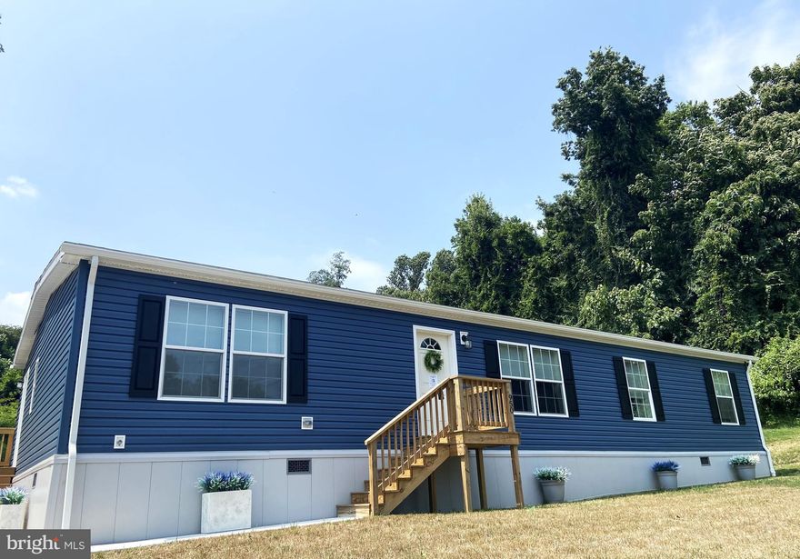 This beautiful ranch-style home boasts 4 bedrooms with 2 walk-in closets, 2 full baths and sits on almost 1/2 an acre.  There is upgraded crown molding throughout the house and an electric wall fireplace.  This is a nature lover's property surrounded by a mature tree-lined yard.  You will have deer frolicking in your backyard and enjoy total privacy as the last house on this dead-end street - and yet, you are less than 1 mile from the heart of Havre de Grace.   The home is constructed with 2x6 exterior walls and has a full crawl space which is protected by a vapor barrier.  Best of all, this home is only 1 year old and still smells like a brand new home!  The propane tank is fully owned (no rental fees!) and has a very low yearly real estate tax.  This home will not last long!

The exterior walls are 2x6. Beyond the home's exterior, you'll discover a shed equipped with electricity. A vapor barrier has been installed in the crawl space.
All permits have been pulled and approved by Harford County. 
Contact us today to schedule a private tour and experience the magic of this coastal haven. Welcome home!