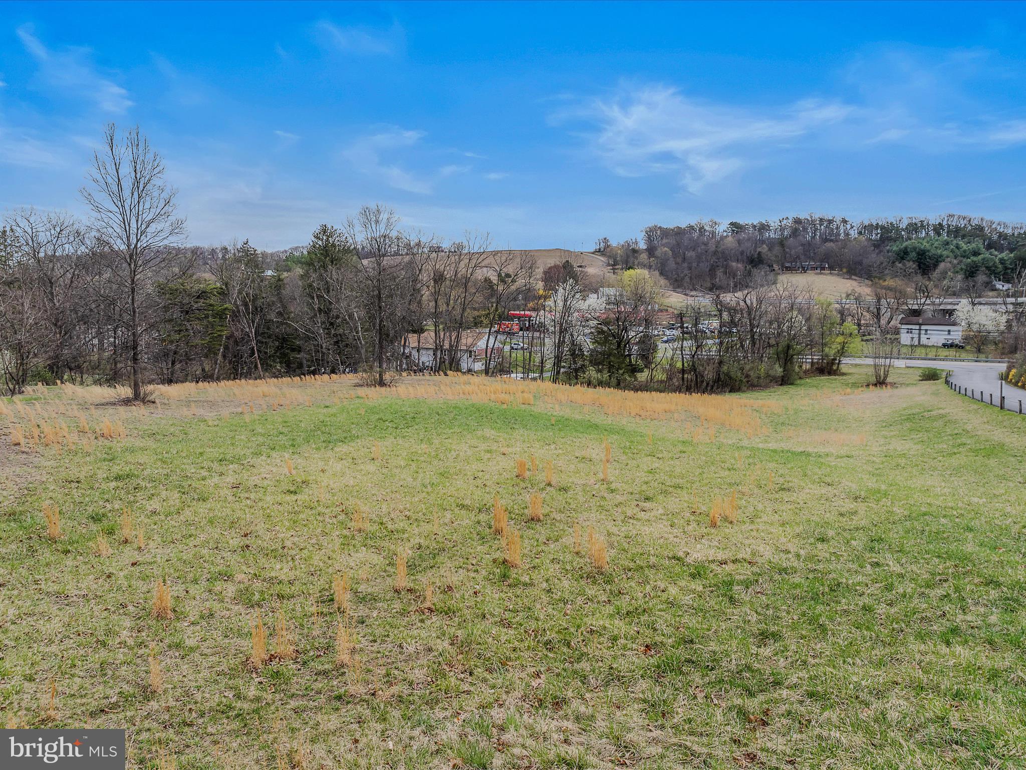 Potential multiple use lot for sale in Morgan County in a great location. High traffic counts in the area if using for commercial. Some building sites sit off the road if used as a residential spot. Gently sloping land with plenty of building sites to choose from. Public water and sewer are available. Access can be gained at several points and along paved roads for convenience.
The property is just north of the new roundabout and bypass which will both improve access while reducing future heavy traffic.
The commutability as a residential development should be great. Easy access to the markets, downtown amenities, and the ability to easily get to Winchester now and - upon the bypass opening A must see!