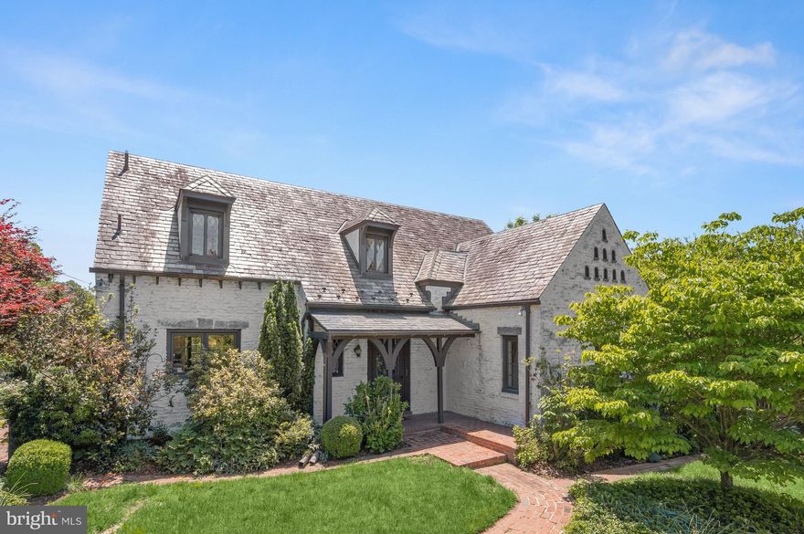 This enchanting Tudor in coveted North Hills is truly one of a kind!  Built in 1931 and lovingly updated and expanded over the years, guests are welcomed in the foyer leading to a spacious living room with stone fireplace, a light drenched sunroom overlooking the gardens, formal dining room, charming kitchen, and two large bedrooms with a shared full bath.  Upstairs offers two additional bedrooms and sitting room along with a second full bath.  The lower level includes office space, laundry and utilities, half bath, and a huge recreation space with a separate entrance.  The special gardens surrounding the home include mature rose bushes, azaleas, and planting beds that bloom throughout the year, a stone patio for relaxing or entertaining, and access to the detached garage and back alley with additional parking. North Hills is a vibrant Silver Spring neighborhood known for its exceptional community culture with beloved traditions like an Annual Fall Festival, Halloween Parade, and summer block parties, along with community gardens, Little Free Libraries, and an engaged Civic Association. Ideally situated inside the Beltway,, residents enjoy the neighborhood's green spaces with Sligo Creek, golf, and parks just steps away and the shops and restaurants of downtown Silver Spring only a mile down the road - all of this with easy access to commuter routes and just 5 minutes to the Silver Spring or Forrest Glen metro. Don’t miss this incredible opportunity!