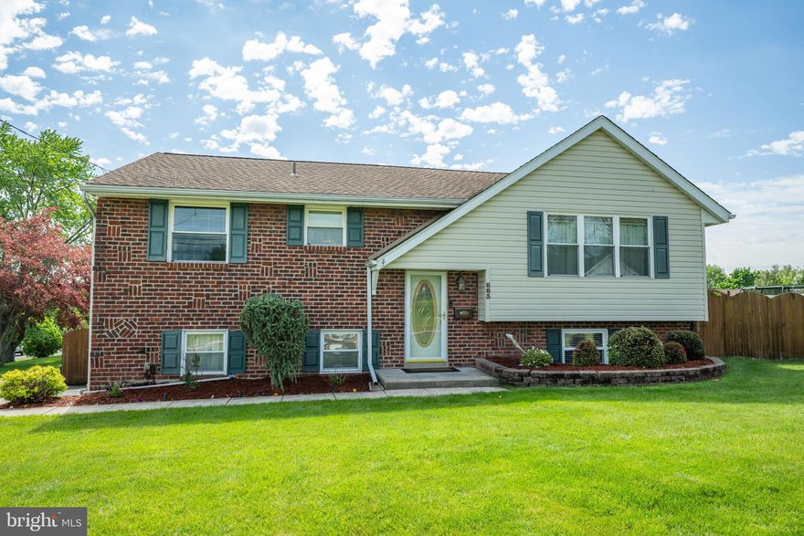 Welcome to this beautifully updated bi-level home offering the perfect blend of comfort, style, and convenience. Featuring 3 bedrooms and 2.5 bathrooms, this home has been thoughtfully maintained and upgraded throughout.

The bright and modern kitchen is a true standout, complete with granite countertops, white cabinetry, stainless steel appliances, and a spacious island - ideal for everyday living and entertaining. Hardwood flooring is featured throughout the main level, adding warmth and character.

All bathrooms have been tastefully updated, including a primary suite with a walk-in shower, a full hall bath with a Whirlpool tub/shower combination, and an updated powder room on the lower level for added convenience. The lower level also offers flexibility, with the potential to easily create a 4th bedroom if desired - perfect for guests, a home office, or additional living space.

The inviting lower level family room features a cozy gas fireplace and direct access to the backyard, creating a seamless indoor-outdoor living experience. A generously sized laundry room provides ample storage, and the attic with pull-down stairs offers even more space for your storage needs.

Enjoy outdoor living in the fully fenced backyard featuring an above-ground pool, a large deck with a retractable awning, and a storage shed - perfect for relaxing or hosting gatherings. The side-entry one-car garage offers convenient inside access and additional workspace.

Ideally located steps from the elementary school in a highly regarded school district, and just minutes from the shops, dining, and charm of Doylestown Borough, this home combines everyday functionality with an exceptional location. Don't delay - schedule your showing today! Showings will begin Friday morning.
