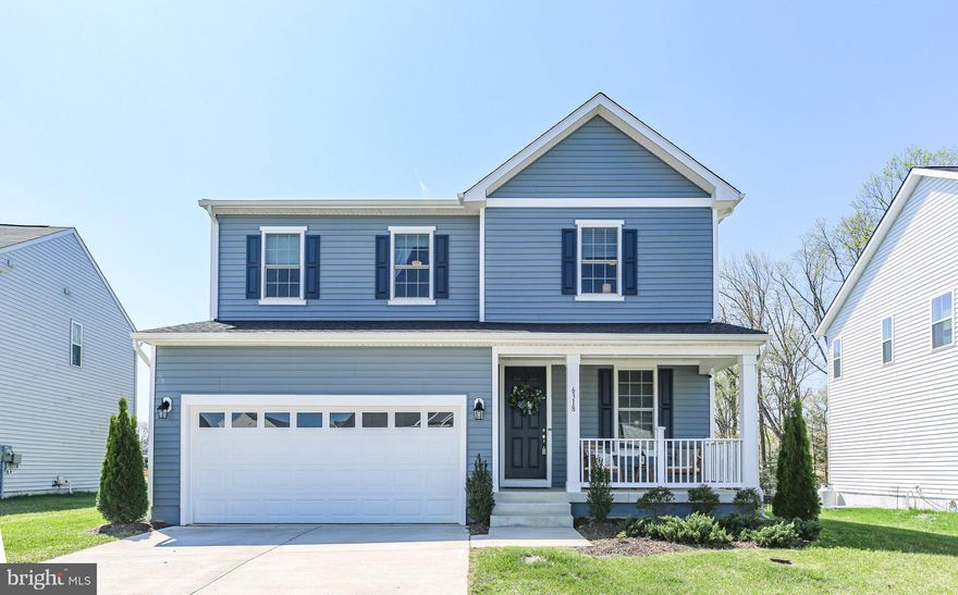 You'll fall in love with this nearly new colonial home, built in 2022 and loaded with upgrades! Nestled on a premium lot backing to a serene wooded common area, this home is located in the sought-after Hopyard Farm community, which offers fantastic amenities, including a pool, tot lots, tennis courts, and a public boat landing. Inside, the inviting open floor plan features 9-foot ceilings and stunning luxury vinyl plank (LVP) flooring throughout the main level. The living room can serve as a home office, while the spacious 15 x 14 family room boasts a striking fireplace with a custom mantel crafted by a local woodworking company. The gorgeous eat-in kitchen is a chef’s dream, featuring granite countertops, stainless steel appliances, an oversized walk in pantry and easy access to the covered rear porch. Upstairs, the spacious primary suite includes a luxurious 7 x 11 walk-in closet and a private bath with a walk-in shower. Two additional bedrooms, a full bath, a versatile loft(perfect as a fourth bedroom or office) and a super nice laundry room complete the upper level. The basement is ready for future expansion, with a rough-in for a full bath. Custom window treatments throughout, including motorized blinds on the sliding glass door, are also included. Don't miss this incredible opportunity!