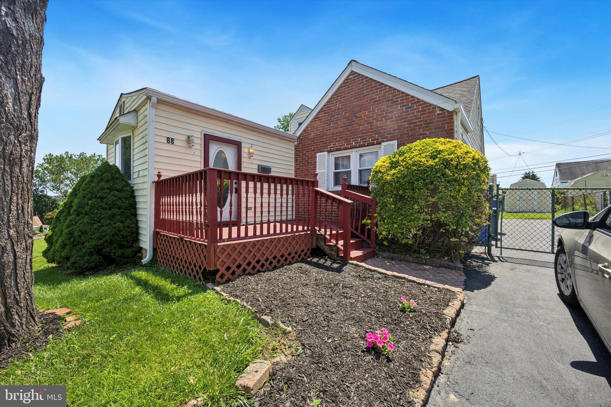 This home is bigger than most in the neighborhood due to the bonus room in the front! Enter from the front deck into the living room boasting laminate flooring, ceiling fan, recessed lighting, a bow window, and an electric heater built in. Next you will find the bright dining room with continuous laminate. The kitchen was renovated in 2022 & offers stainless appliances, pretty blue/grey cabinets, stack stone backsplash, Corieon countertops, deep sink with detachable faucet, tile flooring, recessed lighting, built in trash can drawer & a counter/bar nook. Door to the side driveway/backyard makes unloading groceries a breeze! Next you will find two spacious bedrooms both with ample closet space, ceiling fans & laminate flooring. Hall closet for linens, and a full hall bath with dark vanity, medicine cabinet & a tiled shower with pretty glass doors. Upstairs you will find your third bedroom or loft/playroom area. Closets galore!!! Enter from the office area/dressing room with a large cedar closet, then the bedroom area is a very generous size with big window nook area, deep closet, and small closets/attic crawlspace area.
Out back you will find a shed, deck area & level yard- fully fenced!! HVAC replaced in 2017, Water heater replaced in Oct. of 2017, updated 100 amp electric panel, brand new roof in 2024!!!