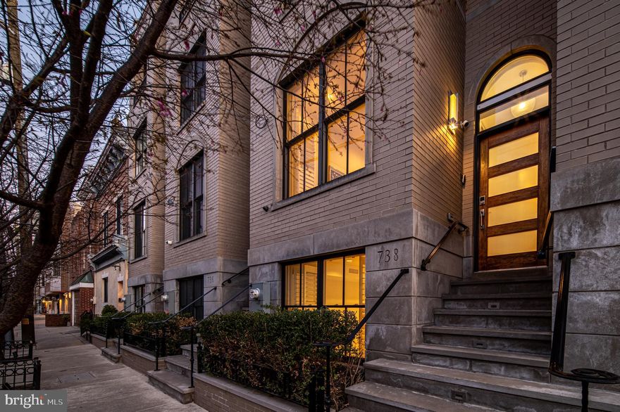 BIG, BOLD, and BEAUTIFUL in the heart of BELLA VISTA!
738 Bainbridge is a modern marvel boasting over 4000 Sq Ft, 5 bedrooms, 4.5 bath home with 2-CAR PARKING, and multiple outdoor spaces!  Special features include glass walled staircases, hardwood floors throughout, high ceilings, smart technology, and an Elevator from garage to roofdeck! This home is stunning from the first level to the fifth level! The heart of the home is the open main level featuring a den/office with French doors, dining area and state of the art kitchen boasting Poggenpohl cabinets, quartz counters, oversized island, 6 burner Wolf gas stove, Sub Zero paneled refrigerator with 2 drawer freezer, Asko dishwasher, and an eat in area. The spacious living area is complete with a powder room, tiled gas fireplace and over-sized deck overlooking Perth street. The third floor includes 2 over-sized bedrooms each with en-suite bathrooms and amazing closet space and hall laundry room. The fourth floor includes the primary suite with an intimate balcony with views overlooking Bainbridge, huge walk-in closet, spa bath with heated floors, dual sinks and large shower and a bonus room that can be a bedroom, family room, or an office with a South facing balcony. A must see are the stunning 360 degree views of Center City from the expansive roof deck! Ride the elevator to the 1st level and find another generous bedroom with en-suite bath, ideally for an in-law, au pair, or guest suite and access to the garage.  Additional highlights include lit stairways, skylight, 5 channel surround sound, In wall speakers and controls in every room, recessed lighting, smart blinds in living room, primary suite and den, and tankless water heater. This location has everything you need within reach including Cianfrani Park, Palumbo Park, Seger Park, Whole Foods, Italian Market, Washington Square and so many neighborhood favorite restaurants. Approximately 4 years left on the tax abatement.  All this plus located in the Meredith School Catchment!