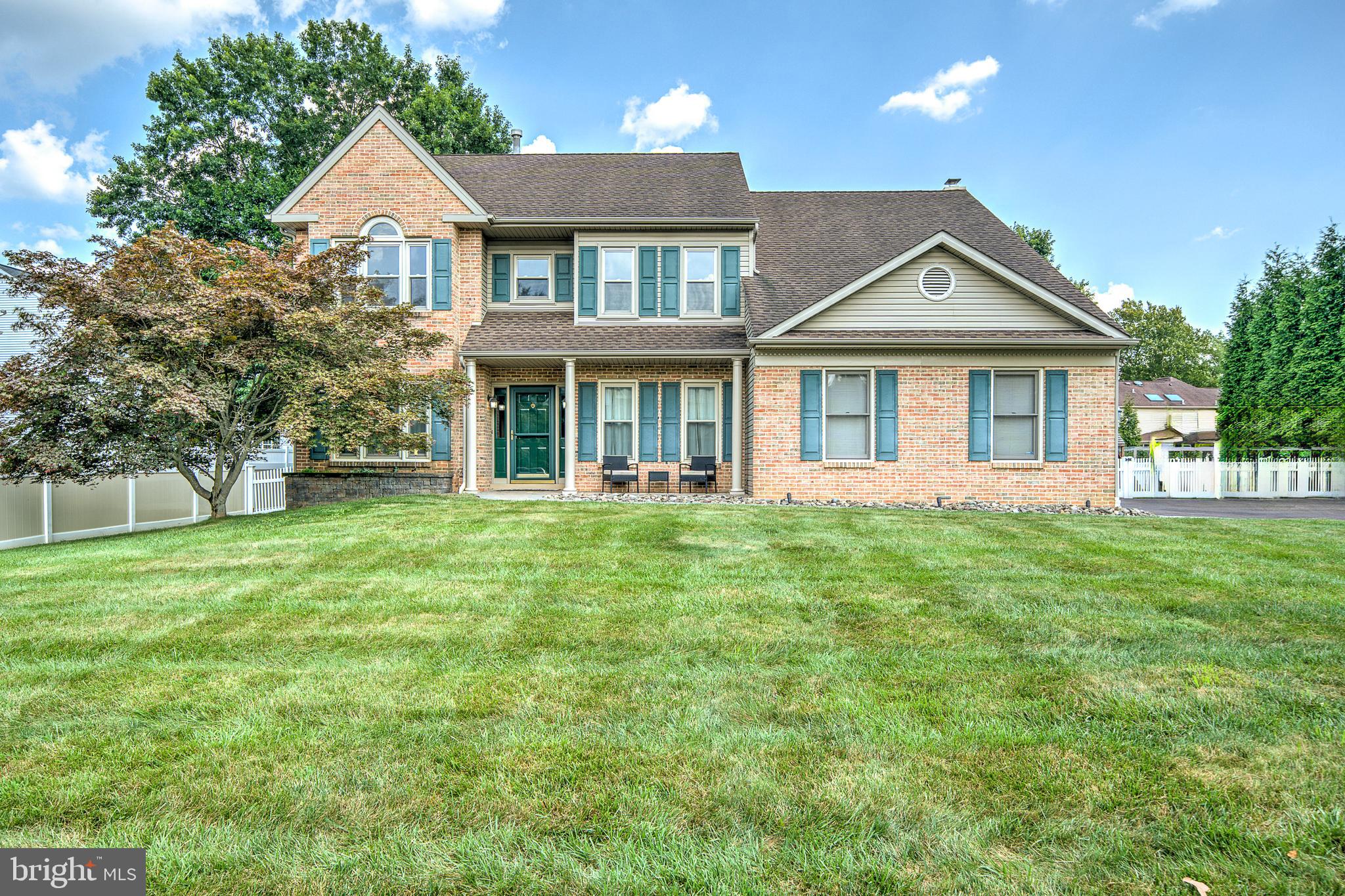 You absolutely must see this stunning 4-bedroom, 3.5-bath Colonial with a two-car attached garage, located in the Collegeville Glen community within the Perkiomen Valley SD. Nestled in the charming Collegeville Borough, this home welcomes you with a dramatic two-story entryway that flows seamlessly into the formal dining room and a former office currently serving as an art room. The entire first floor showcases hardwood flooring and a bright, open layout. The spacious kitchen opens to a light-filled family room aligned with windows and a cozy fireplace, making it the perfect space for relaxing or entertaining. From here, step out onto a large custom-built paver patio overlooking a heated inground pool and fully fenced-in backyard, providing an ideal space for outdoor gatherings and everyday enjoyment. The main level also includes a convenient laundry room, powder room, and direct access to the two-car garage. Upstairs, you’ll find four generously sized bedrooms, including an impressive primary suite with two closets and a luxurious en suite bathroom featuring a soaking tub and separate shower. A full hall bath and three additional bedrooms complete the second floor. The finished basement offers more living space with a private office, a full bathroom, a custom-built bar ideal for indoor entertaining, a raised seating area perfect for movie nights or a home theater setup, and two additional storage areas. Outdoor living is just as impressive, with a beautifully hardscaped backyard and an in-ground heated pool providing you with your personal retreat for summer fun and relaxation. The neighborhood is quiet, well-maintained, and conveniently located just minutes from Providence Town Center, located in highly desired PVSD, with shopping, dining, and easy access to Route 422. This is a rare opportunity to own a move-in-ready home in one of Collegeville’s most in-demand communities. Inquire today, as this one won’t last!