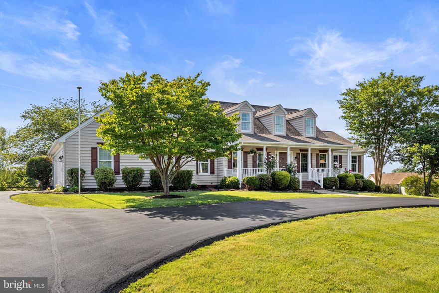 Discover this charming Cape Cod home with three finished levels, nestled on a stunning 1+ acre lot at the end of a cul-de-sac just outside of town. The main level boasts elegant living and dining rooms adorned with detailed molding and hardwood floors. An expansive kitchen with granite countertops, an island, and a breakfast bar seamlessly connects to the family room and a sun-drenched sunroom. The spacious owner's suite features a custom closet and a luxurious bathroom with granite counters and a jetted tub. The upper level offers three additional well-appointed bedrooms and a guest bathroom. The finished basement includes a large bar area with a refrigerator and dishwasher, a generous rec room, a 5th bedroom (NTC), and a full bath. Walk out to a vast patio area and a fenced backyard. Outdoor features include a newer 12x30 Trex deck with panoramic views of the landscaped yard. Enjoy the privacy and tranquility of no HOA. This home is perfect for both entertaining and everyday living, combining elegance and comfort in a peaceful setting.