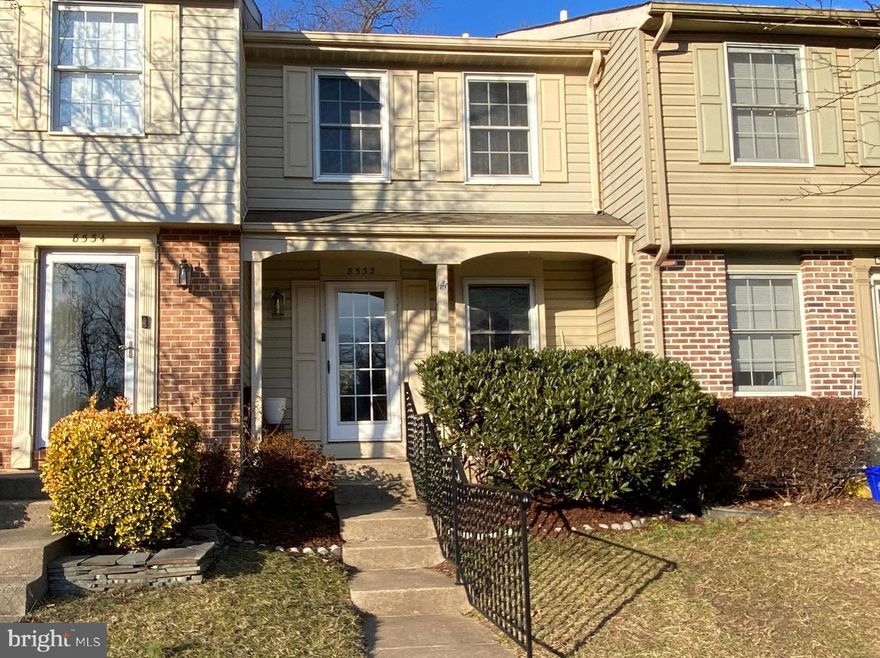 Welcome to 8532 Golden Ridge Ct, a charming 3-level, 2-bedroom, 2-bathroom townhome in the heart of Newington Heights. As you arrive, you’ll be greeted by a picturesque front porch and a new black iron stair railing for easy access.  The porch is the perfect spot to enjoy your morning coffee or chat with neighbors. The inviting exterior sets the stage for the warmth that awaits inside. Step through the front door into a freshly painted home with a soft, warm off-white palette that creates a bright and fresh atmosphere. The main level features a welcoming foyer and a double-door coat closet for added convenience. The kitchen boasts granite countertops and a pass-thru window that connects you to the dining area, making entertaining a breeze. The living room is bathed in natural light, and the sliding glass doors open to a private deck with a serene wooded view—an ideal space for grilling or relaxation.  Upstairs, the primary bedroom is a retreat, complete with double closets, a ceiling fan, and a built-in dressing vanity. The ensuite full bath offers convenience with hallway access. The second bedroom features large double closets and a ceiling fan.  A linen closet provide extra storage, ensuring everything has its place. The upstairs carpet was replaced in 2024.  The lower level has a recreation room with a brick-surround wood-burning fireplace for cozy movie nights in. With a full bathroom on this level, the rec room could be converted to a guest room or office.  A dedicated storage/laundry room adds practicality to this versatile level. The walk out door leads to a fully fenced backyard with a beautiful brick patio and detached shed.  Parking is effortless with an assigned space directly in front of the home (#306), plus additional parking available via the HOA, plus there is ample guest parking nearby. This is a prime location for commuters with I-95 and the Lorton Station VRE nearby, making commuting to D.C., Fort Belvoir, and the Pentagon a breeze. Walk across the street and take the path to the beautiful Newington Heights Park 
 with a tot lot, tennis & basketball courts and a community sports facilities, plus the Liberty Shopping Center is near by. The Lorton Workhouse Arts Center is just around the corner, offering endless opportunities for entertainment and cultural experiences.  And let's not forget it's zoned for the highly rated Silverbrook Elementary School and South County Middle and High schools!  For added peace of mind, the HVAC system is under an annual maintenance contract with Cropp Metcalf, and the home comes with a transferable Choice Home Warranty.  Schedule a showing today and fall in love with everything 8532 Golden Ridge Ct has to offer!