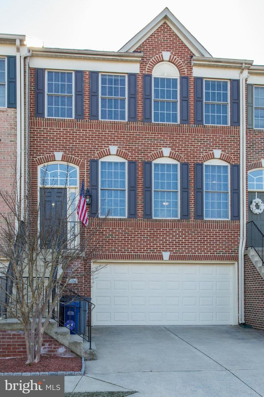 Welcome to this Stunning Brick 3 Level Townhouse in a gated community with 3BR, 3.5BA and a 2 car garage.Hardwood floors on all three levels, great open kitchen with family room and a double sided fireplace & recessed lighting. Deck on main level facing trees and a patio off the rec room. Huge storage in garage. Lots of improvements including a recent updated master bath.