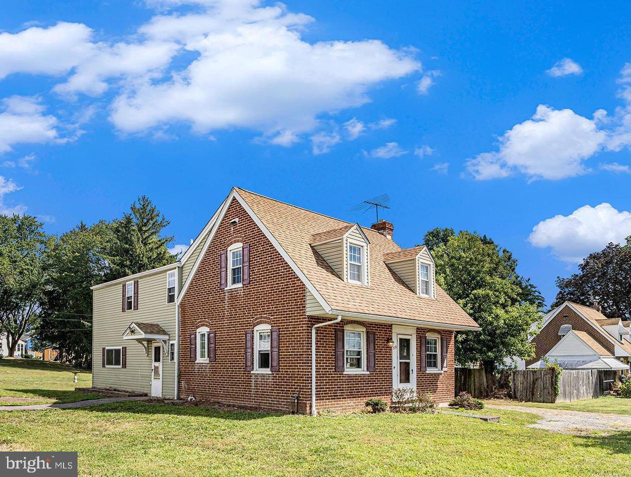 A family home for many decades is now ready for others to create memories here! This home is zoned for residential PROFESSIONAL USE. While the interior will need some TLC, the home has a newer roof (2020), windows and siding, so you can roll up your sleeves and design the interior to make it yours. Additionally, the seller is offering a 1 Year AHS Home Warranty for your peace of mind. The brick home, built in 1941, still has some original hardwood floors beneath the carpet while the 1970 addition creates so much more living space for this charming Cape. The front door with full view storm door opens into a living room filled with natural light from all the windows. The adjacent dining room is light and bright with a chandelier and room to gather everyone for holiday meals. The kitchen has loads of storage and counter space with features including oak cabinetry with Corian counters, an undermount porcelain sink with disposal, tiled backsplash, undercabinet and recessed lighting, ceramic tile floor, smooth surface electric range, GE stainless steel built-in microwave, GE dishwasher and Maytag refrigerator. Next to the kitchen is a laundry room with double closets, upper cabinets, outside access, a convenient powder room with built-in storage and the washer, dryer and freezer are included. Double doors lead into a wood paneled room with a wall of closets, perfect for an office or even a 5th bedroom. Beyond the laundry room is a massive family room with a door accessing the driveway as well as sliding doors to a paver patio and the back yard. On the upper level, a dedicated hallway with linen closet leads to the primary suite that has an enormous bedroom with double doors, ceiling fan, walk-in closet, double closet and a full bath with ceramic tiled walls, floors and stall shower. Bedroom 2 has a double closet, while bedrooms 3 and 4 have the original hardwood floors beneath the carpet. These bedrooms share a full hall bath with linen closet, medicine cabinet, ceramic tile floor and tub with ceramic tile shower surround. An unfinished basement provides room for storage as well as a large shed in the back yard. The well pump was replaced 7/2025 and the property also has the opportunity to hook up to public water. There is a Bradford White hot water heater and oil heat. While the home has central A/C, it is not currently working. A great home and great area to live in near shopping, schools, parks, commuting and entertainment.