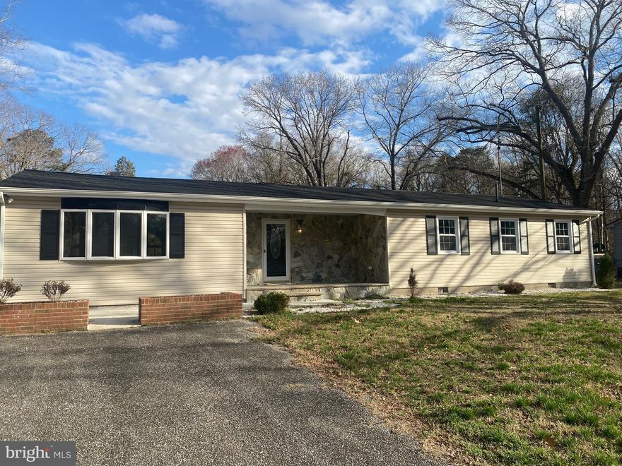 Completely remodeled and move-in ready, this 3BR/2BA rancher is perfectly situated on nearly 2 acres just east of Seaford—adjoining the desirable Pines neighborhood, but with no HOA fees or restrictions. Enjoy the best of both worlds with a private setting and convenient location, all without town taxes or water and sewer bills. Home features a traditional floor plan with a spacious dining room and a large living room highlighted by a wood-burning fireplace. The brand-new kitchen is a standout, offering custom cabinetry, granite countertops, and a fresh, modern feel throughout and the entire home has been updated with fresh paint. Outside, the property shines with a massive cleared backyard that is partially fenced—perfect for pets, gatherings, or future possibilities. A new LPP septic system provides added peace of mind and in addition to the oversized 2-car detached garage, there is a separate outbuilding ideal for entertaining, hobbies, or additional storage!!!