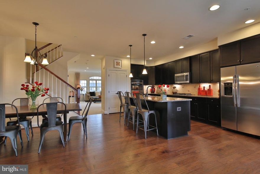 VERY SPACIOUS New construction townhome condominium over 2,600 sq. ft in a very convenient location, just 3 miles to 295 & 495. Lives like a Single Family Home!! Large open kitchen with huge island, walk in closets, and much more! 3 bed, 2.5 bath, 1 CG. Hardwood floor in kitchen and family room!For A Limited Time  All Closing Paid on this home with use of NVRM! Images are representative only. 200H